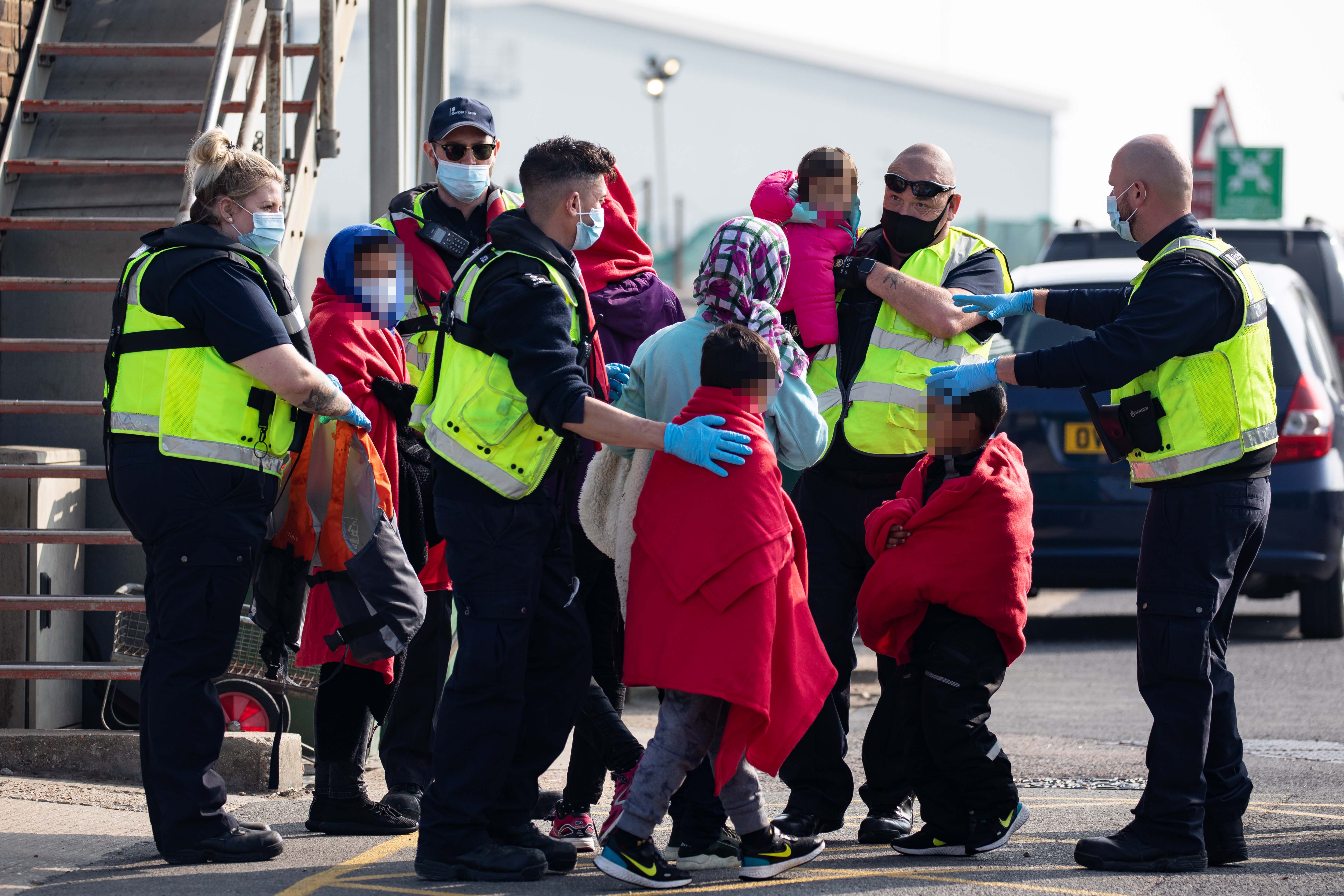 A migrant family is taken into port after being intercepted by Border Force officials in the English Channel in September 2020