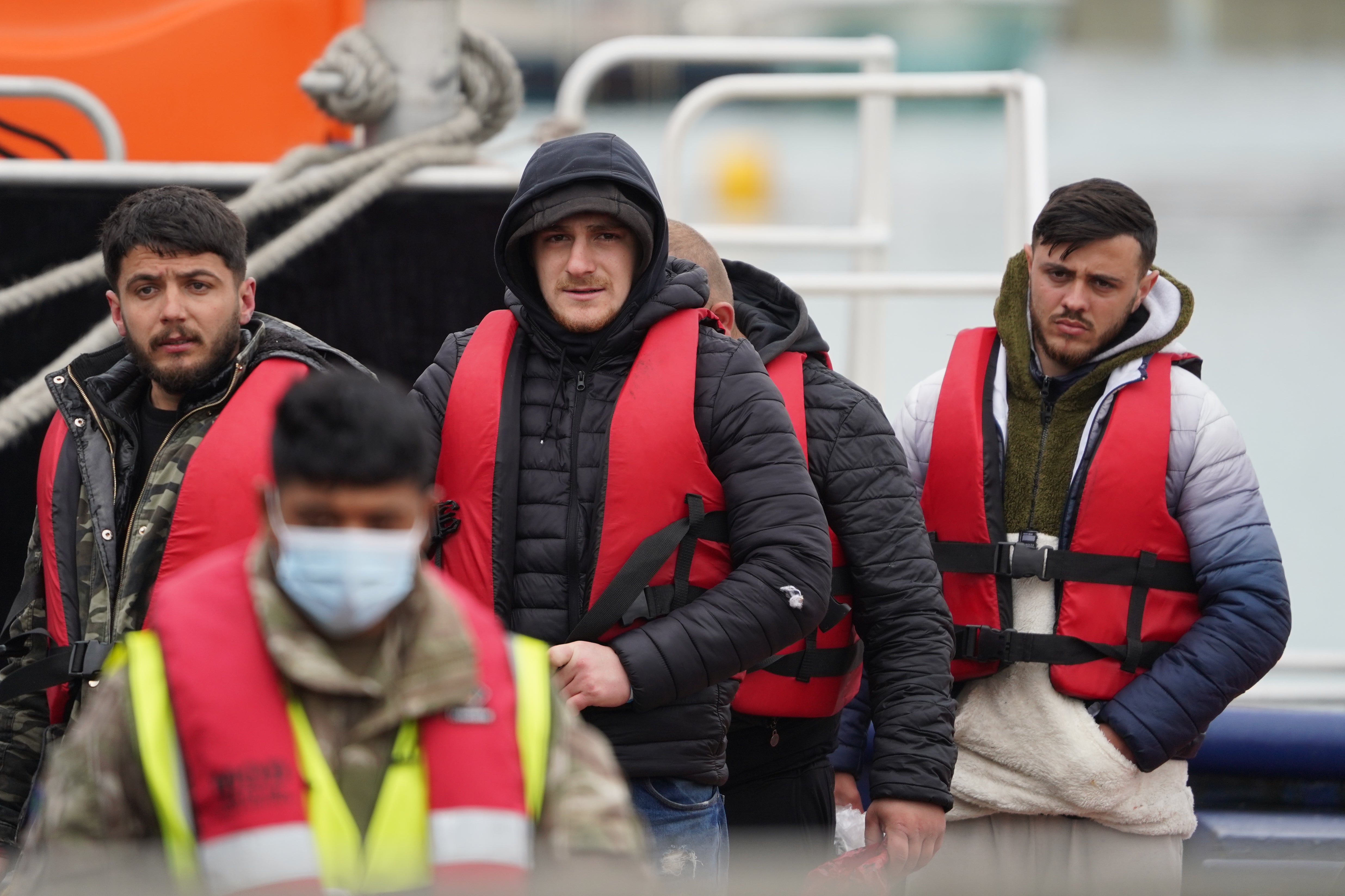 A group of people thought to be migrants are brought in to Dover, Kent, following a small boat incident in the Channel (Gareth Fuller/PA)