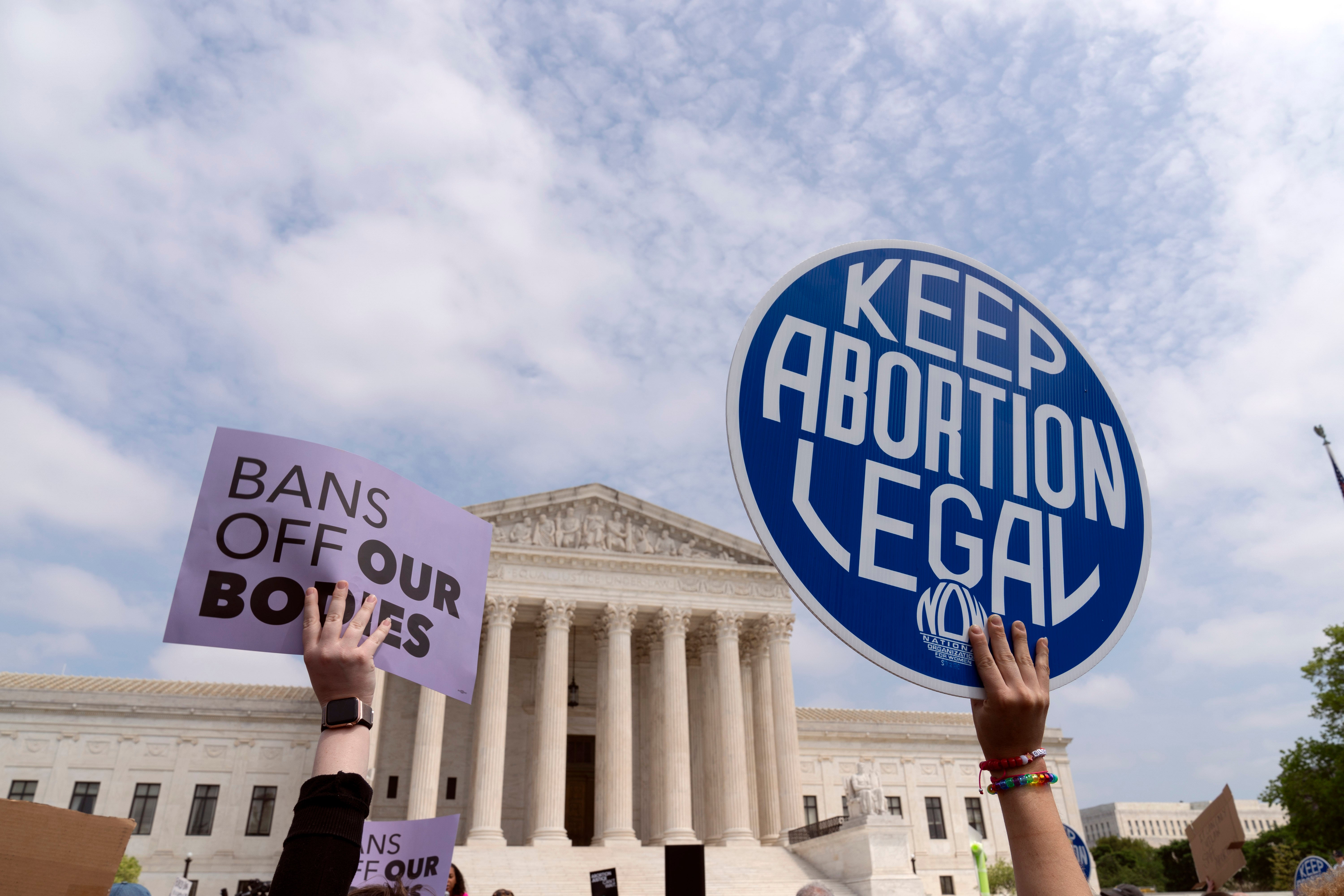 Protesters gather outside the Supreme Court in response to the majority opinion