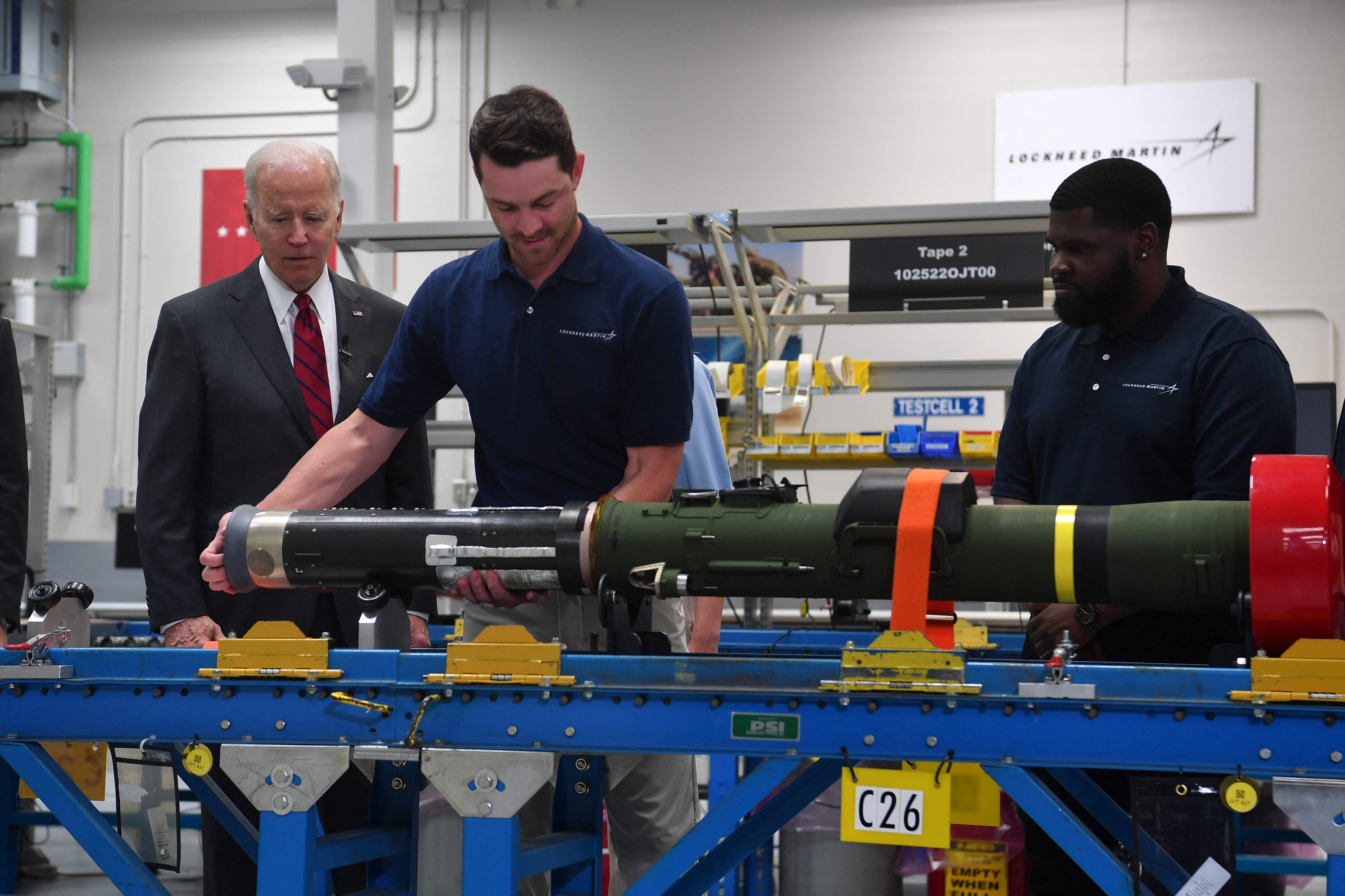 Biden watches employees as he tours the Lockheed Martins Pike County Operations facility in Troy, Alabama