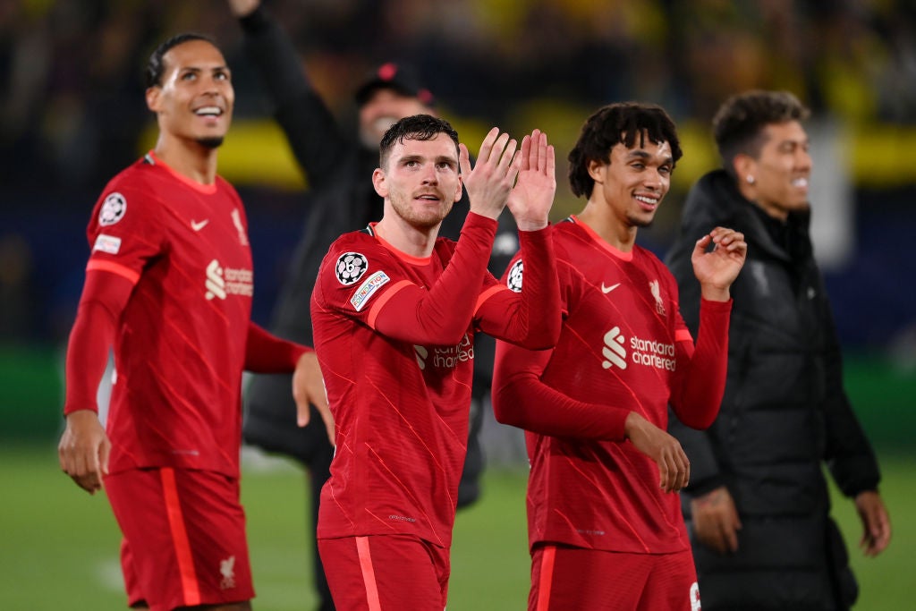 Liverpool players applaud the travelling supporters in Spain