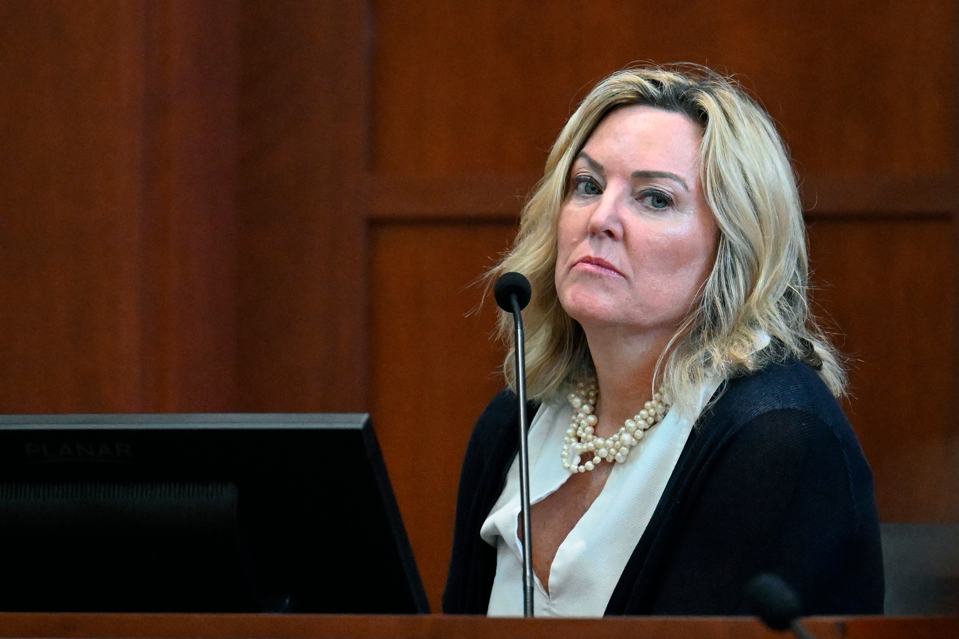 Forensic psychologist Dr. Dawn Hughes testifies as the first defense witness for actress Amber Heard at the Fairfax County Circuit Court in Fairfax, Va., Tuesday May 3, 2022.