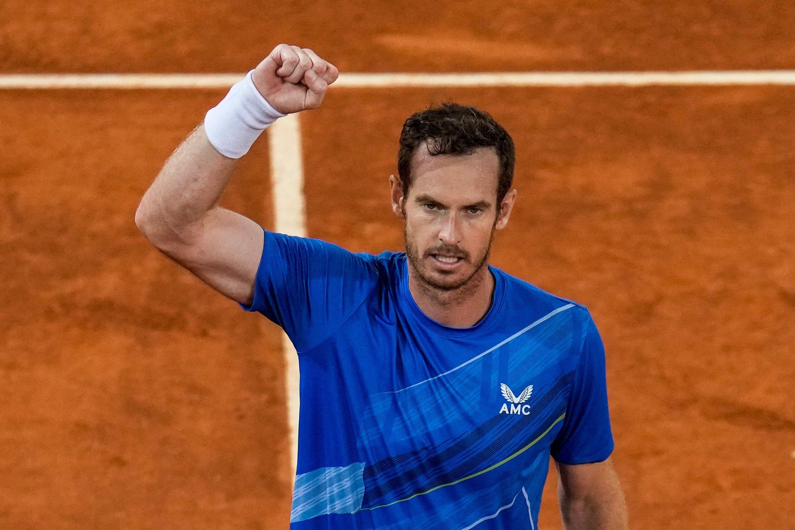 Andy Murray celebrates his victory over Dominic Thiem of Austria during their match at the Mutua Madrid Open tennis tournament in Madrid (Manu Fernandez/AP)