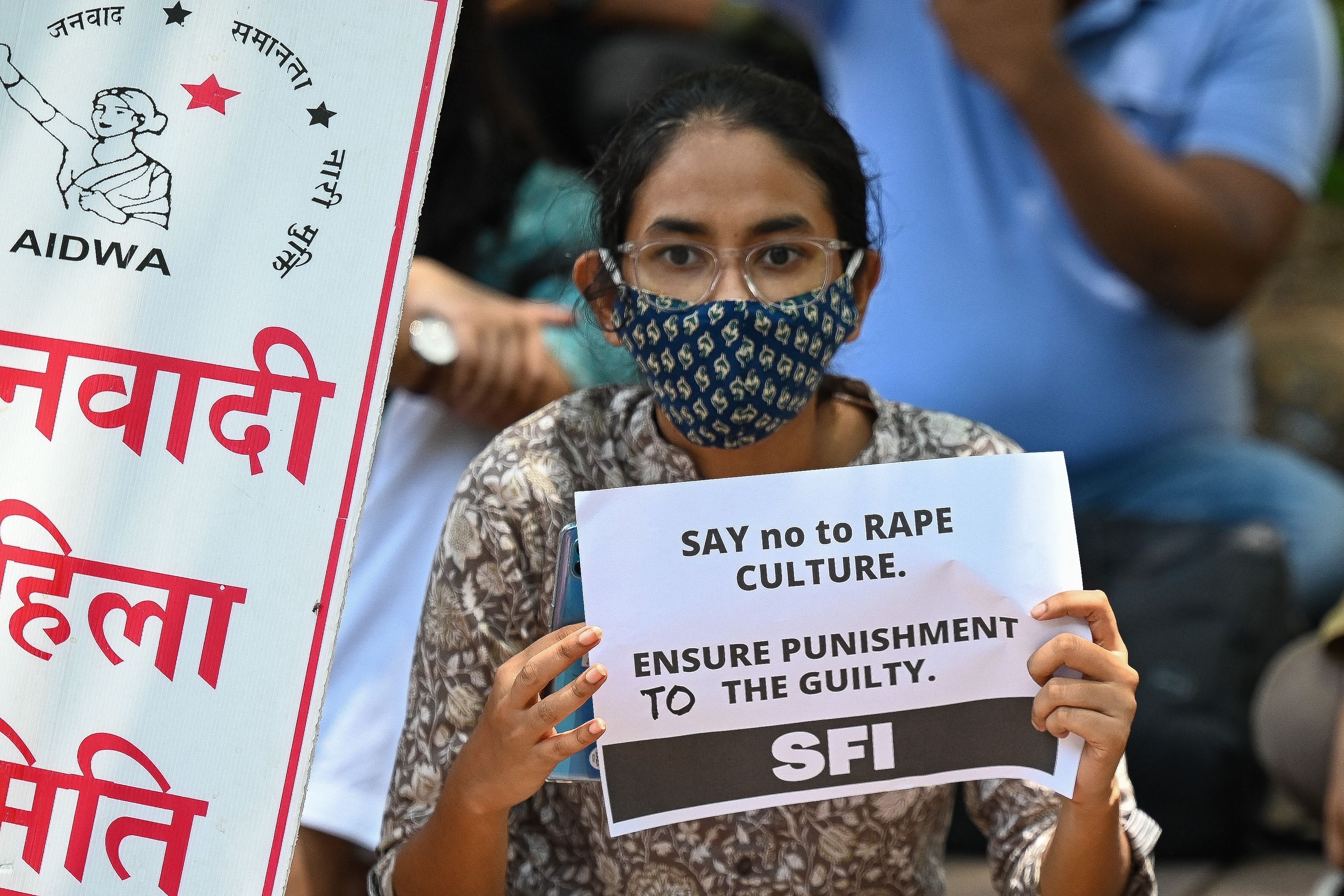 File: Activists of Student Federation of India (SFI) and All India Democratic Women’s Association (AIDWA) hold placards during a protest against rape in India