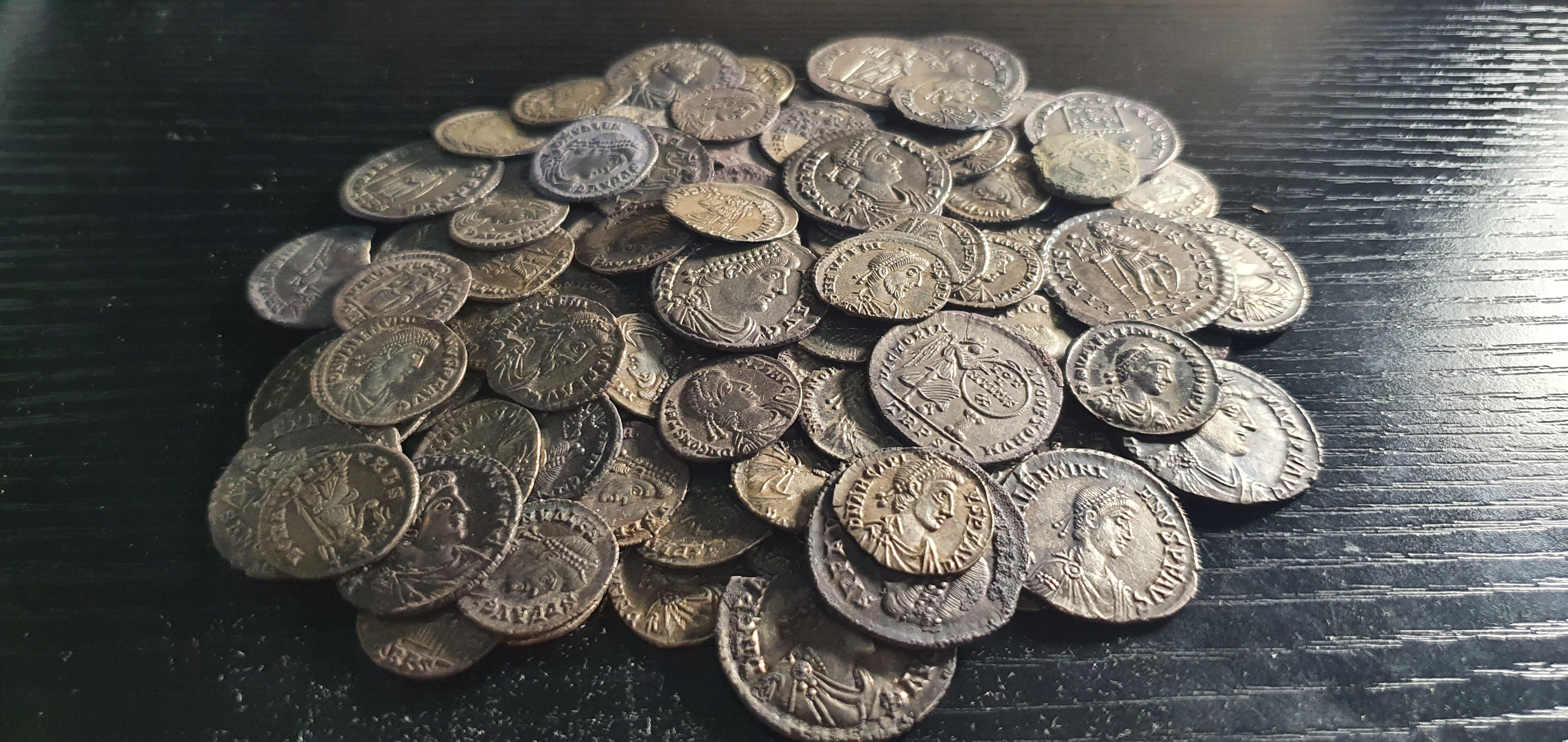 The Pewsey hoard of Roman coins discovered in Wiltshire by three detectorist friends (Noonans)