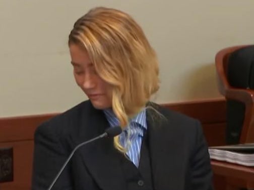 Amber Heard could be seen smiling in court during Dr Dawn Hughes’ testimony