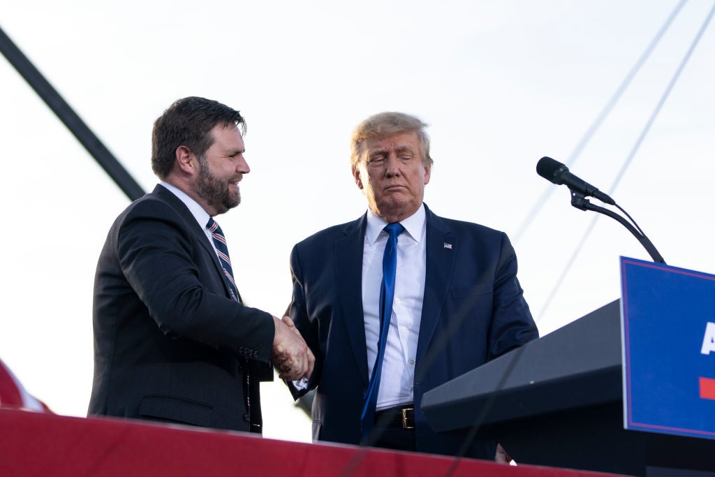 JD Vance shakes Donald Trump’s hand at a 23 April rally in Ohio, weeks ahead of the state’s primary election