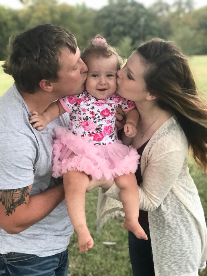 Dustin and Josy Baker with their daughter Lylah when she was about two years old, before she fell ill with melioidosis