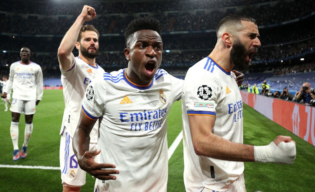 Real’s Karim Benzema (right) shows exactly what his winning penalty means