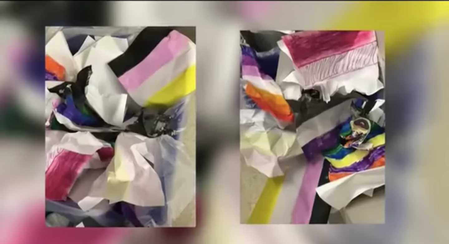 The crumpled up flags from Casey Scott’s art class are seen in a recycling bin after she was asked by school administrators to remove the illustrations from her wall.