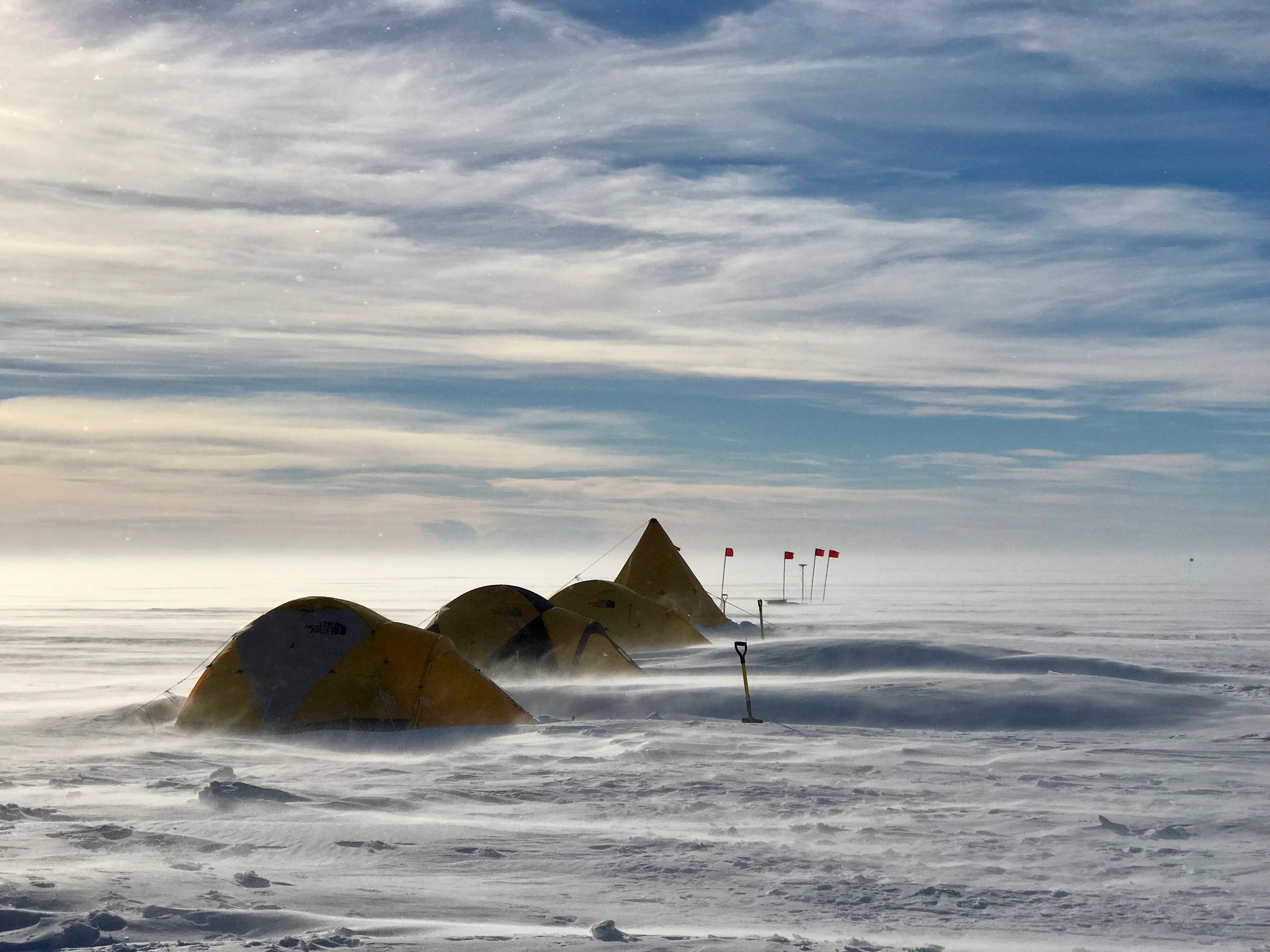 The team’s sleeping tents on the windy snow