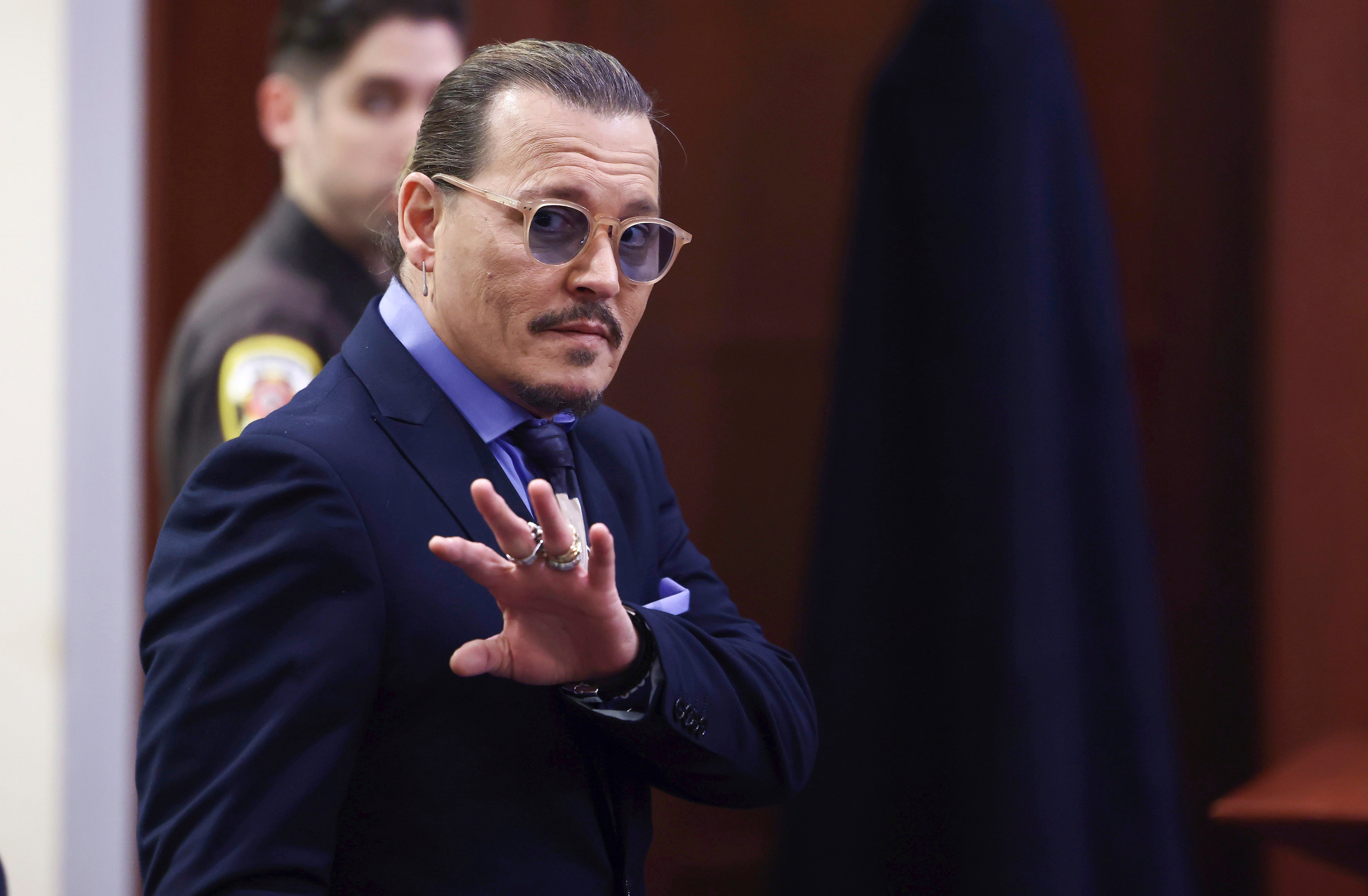 Mr Depp is suing the Aquaman star for libel over a 2018 article she wrote in The Washington Post (Jim Lo Scalzo/AP)