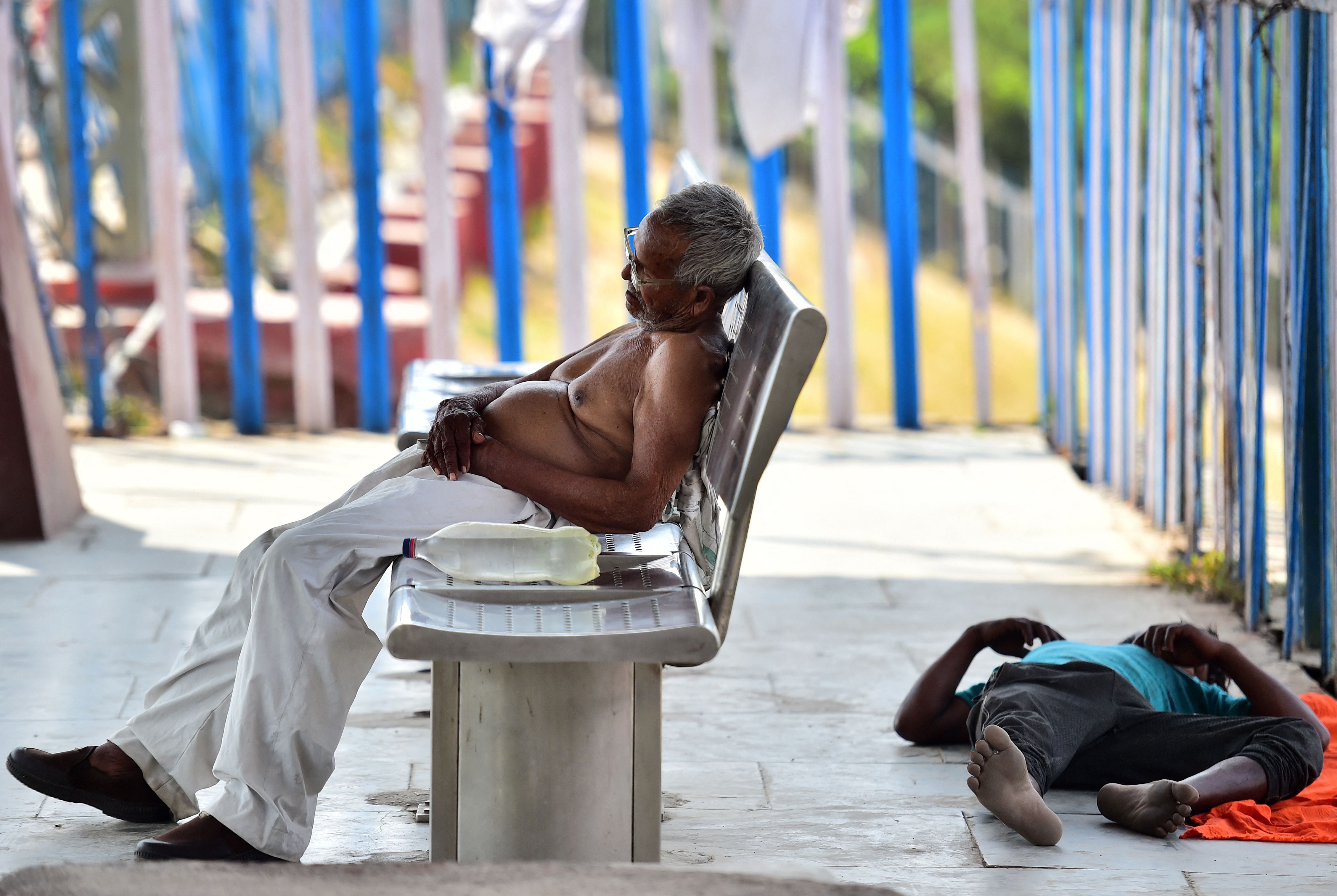 People rest on a platform at Daraganj railway station in Allahabad, Uttar Pradesh