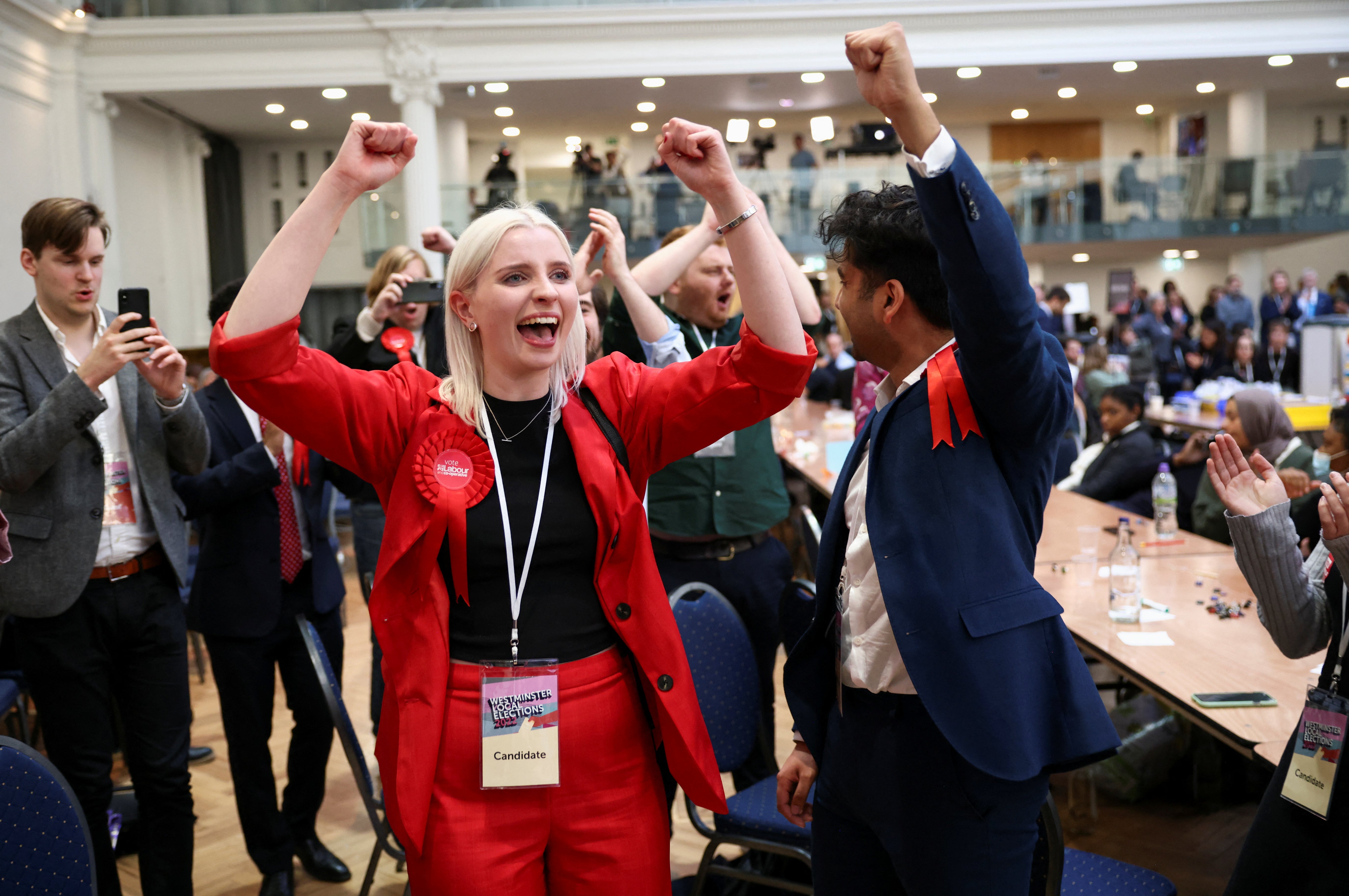 Labour candidates and supporters celebrate after they gain Westminster City Council