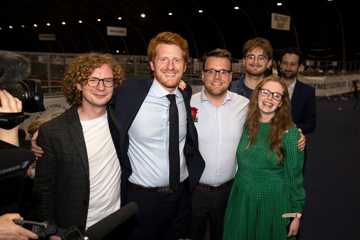 SDLP candidate Matthew O’Toole (second from left) is elected in South Belfast (Liam McBurney/PA)