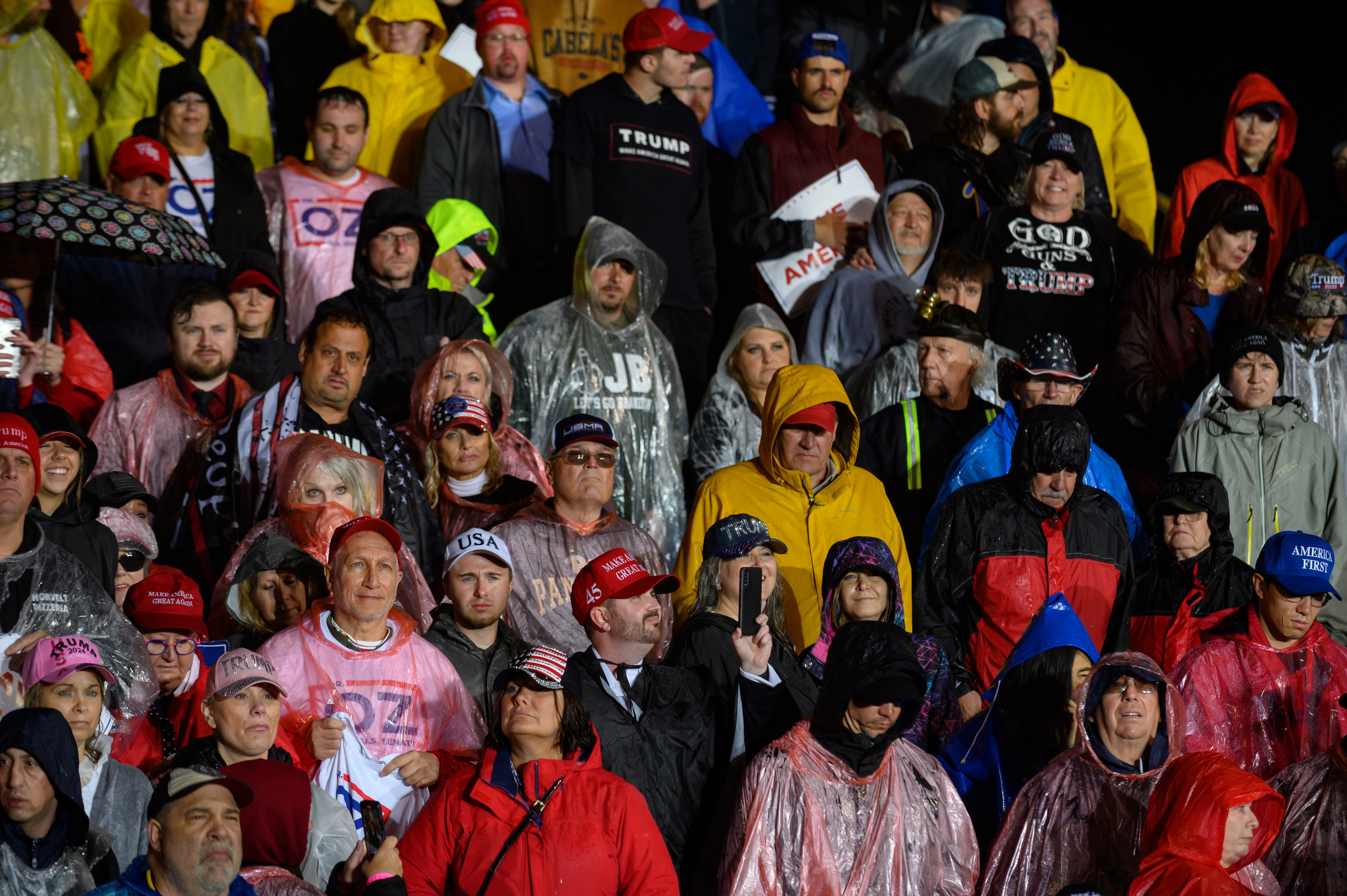 Rain-drenched Trump supporters attend a MAGA rally in Greensburg, Pennsylvania