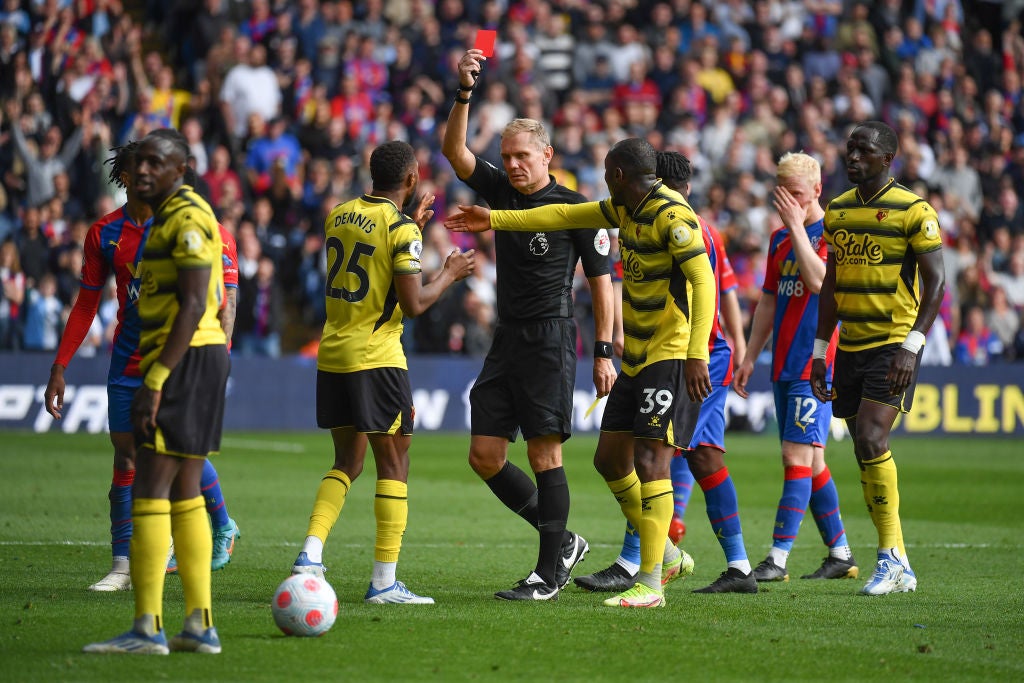 Hassane Kamara is shown a red card by referee Graham Scott