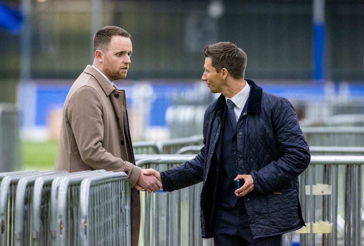 UUP’s Ryan McCready (right) shakes the hand of the DUP’s Gary Middleton wishing him good luck as he concedes the final seat as an MLA for Foyle in the Northern Ireland Assembly election (Liam McBurney/PA)