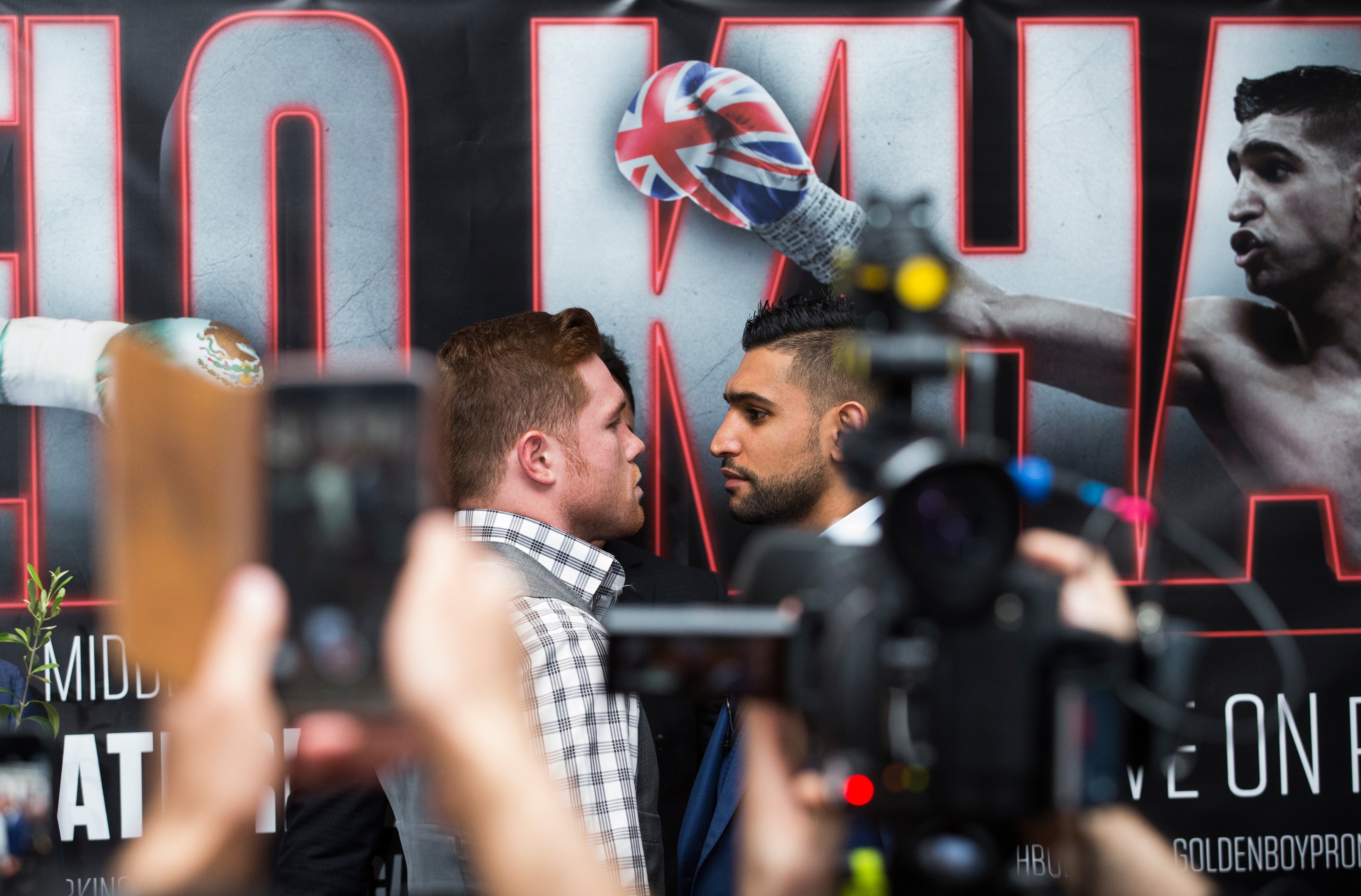 Saul Alvarez (left) and Amir Khan (right) during a press conference ahead of their world title fight (John Walton/PA)