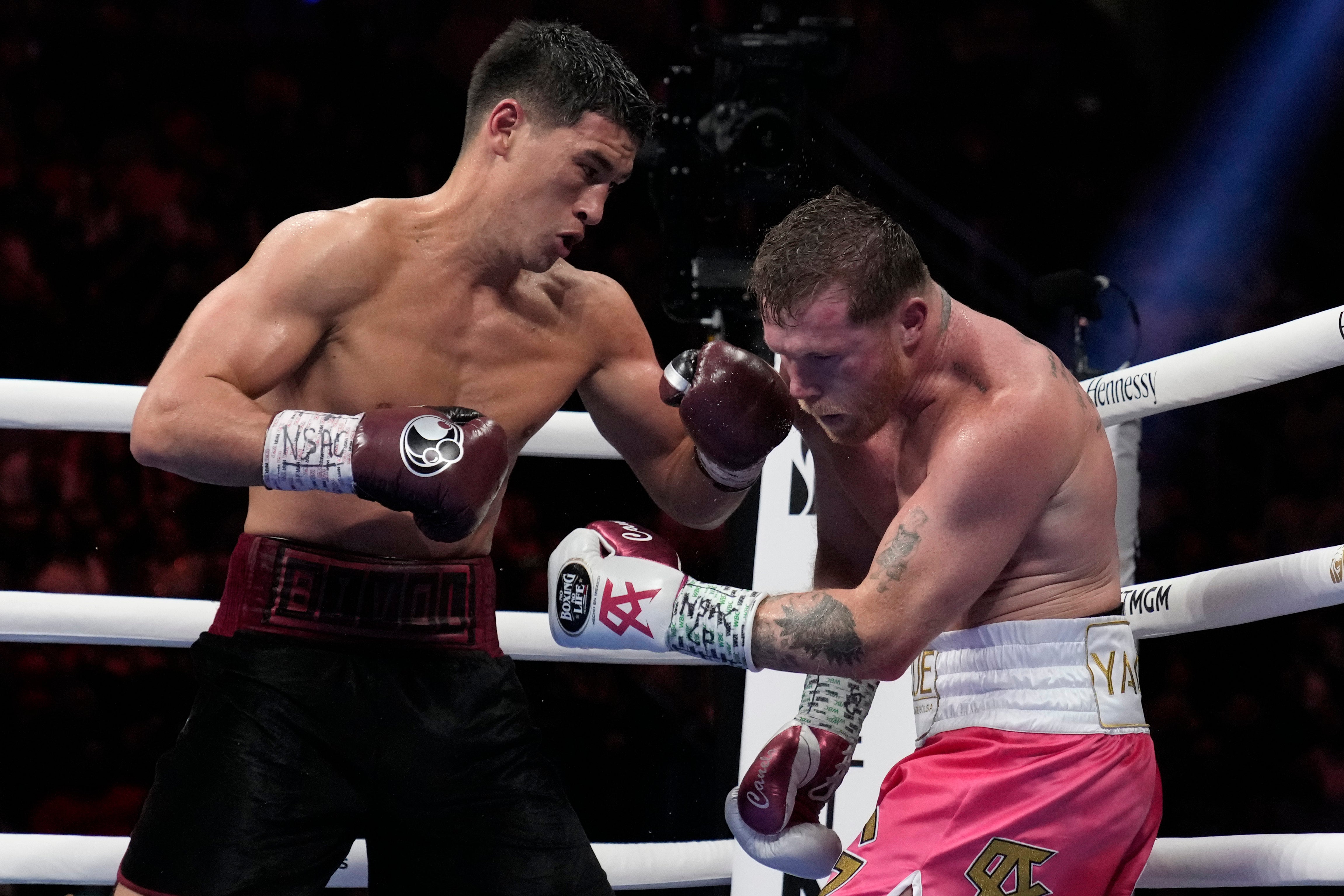 Dmitry Bivol (left) earned a unanimous-decision win against Canelo