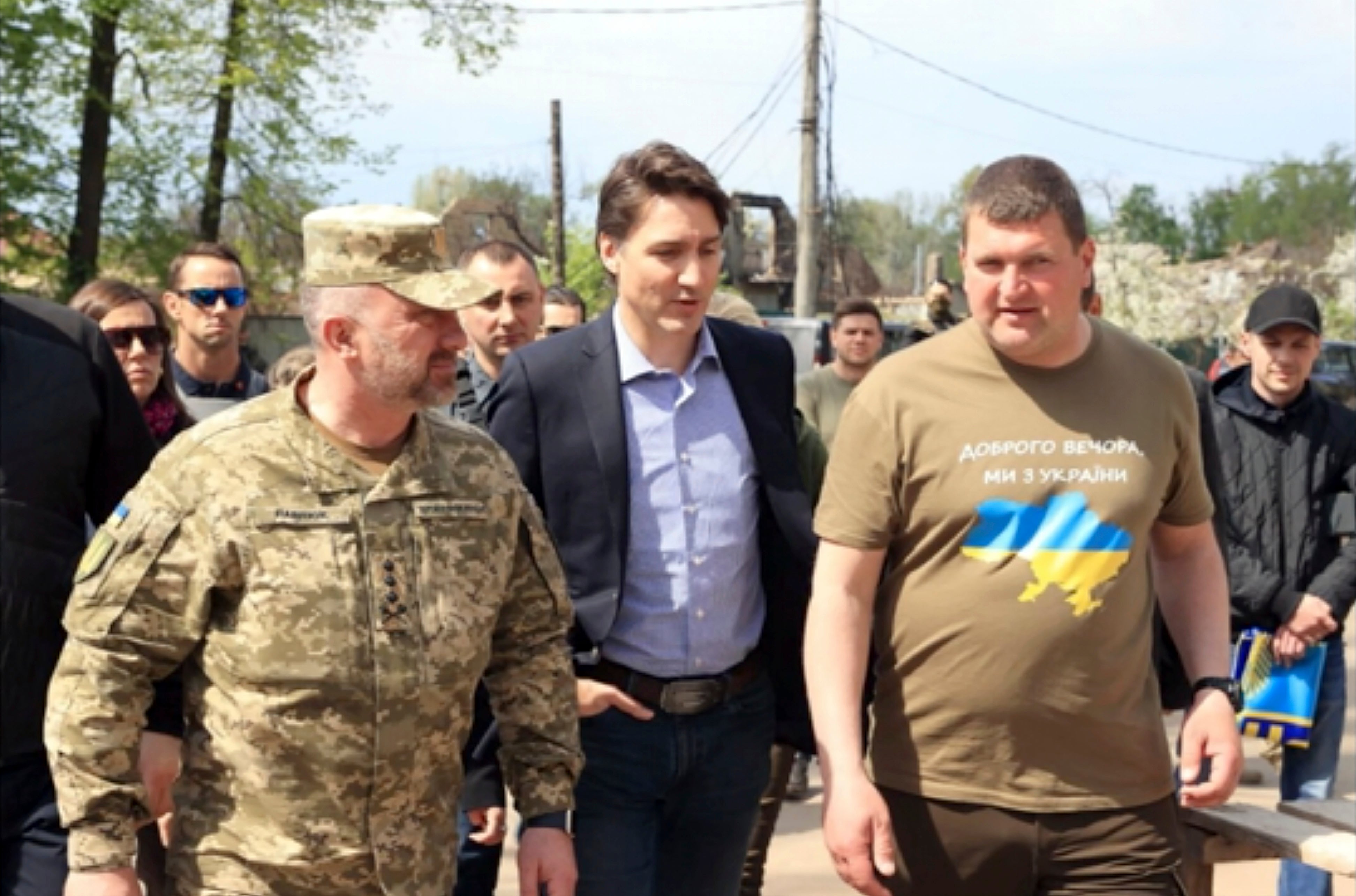 Canadian Prime Minister Justin Trudeau walking with mayor Oleksandr Markushyn, right, in Irpin, Ukraine