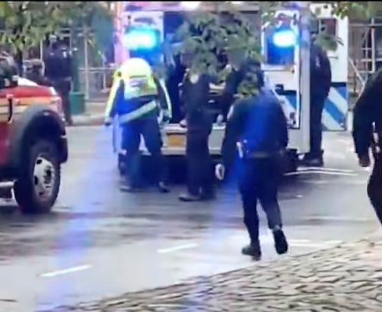 First responders attend the shooting of two boys near Central Park on Saturday