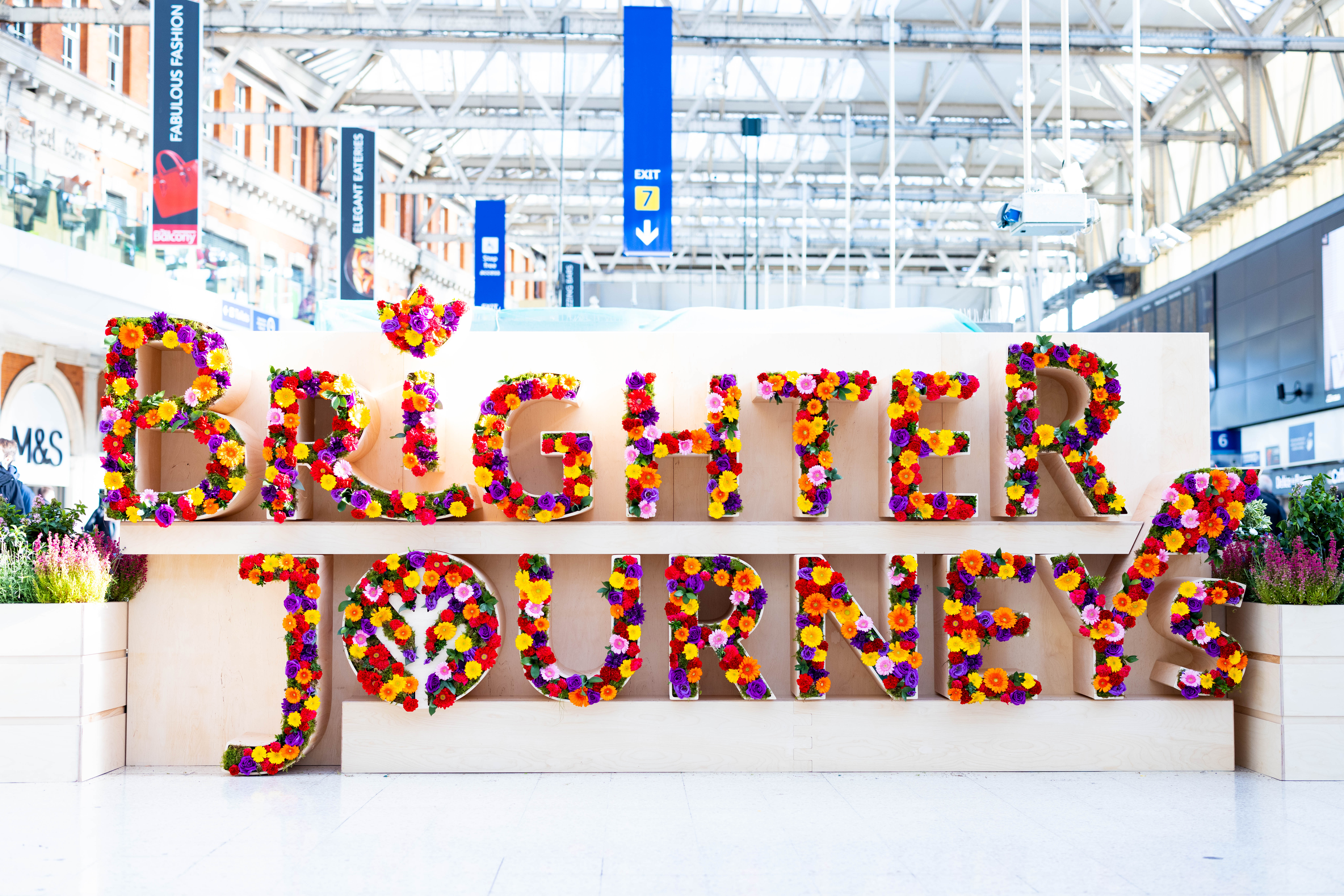 Train passengers will be greeted by colourful flowers at major stations across Britain to promote a mental health campaign (David Parry/PA)