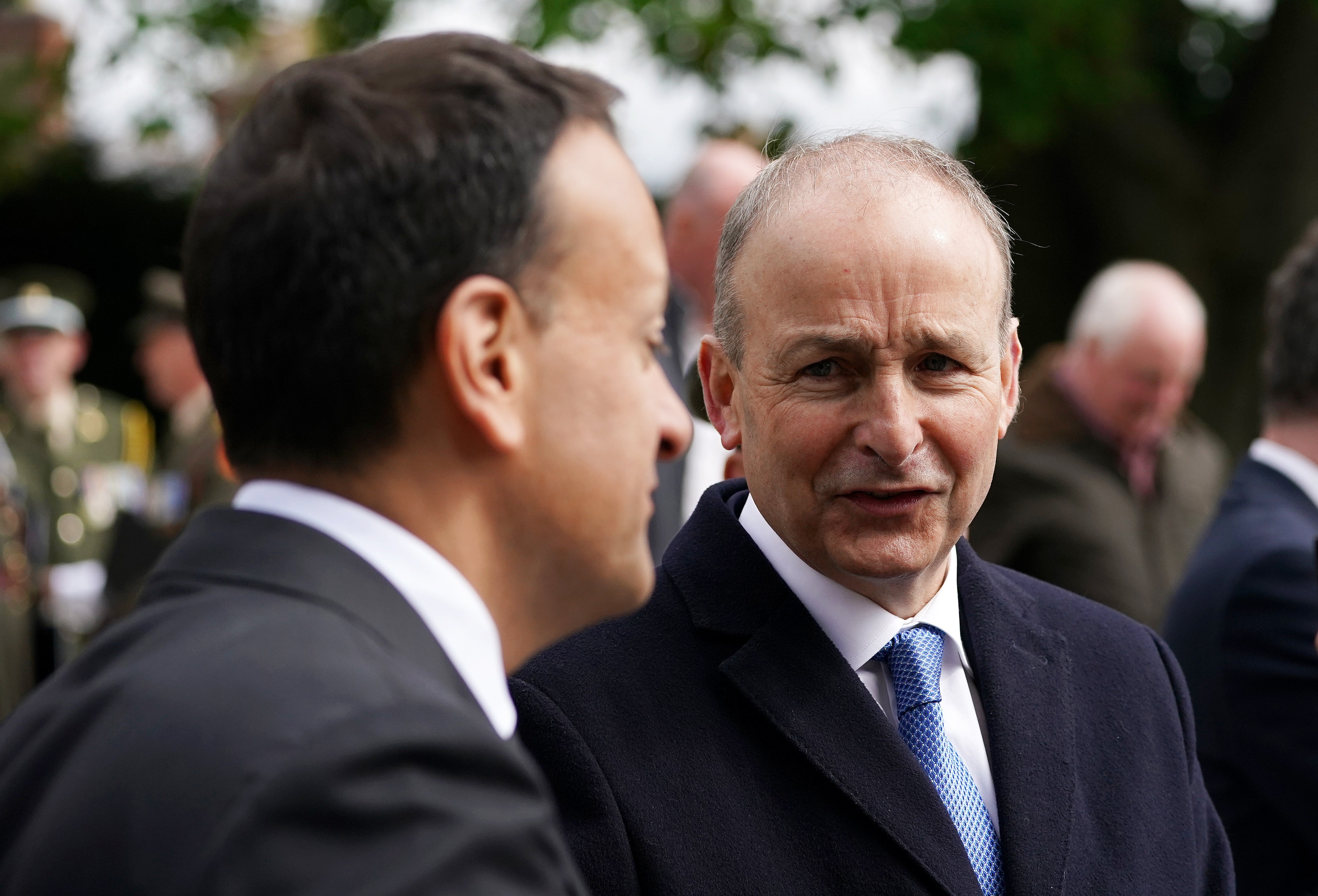 Taoiseach Micheal Martin (right) in conversation with Tanaiste Leo Varadkar following a state religious ceremony to commemorate the 1916 Easter Rising leaders at Arbour Hill Cemetery in Dublin (Brian Lawless/PA)