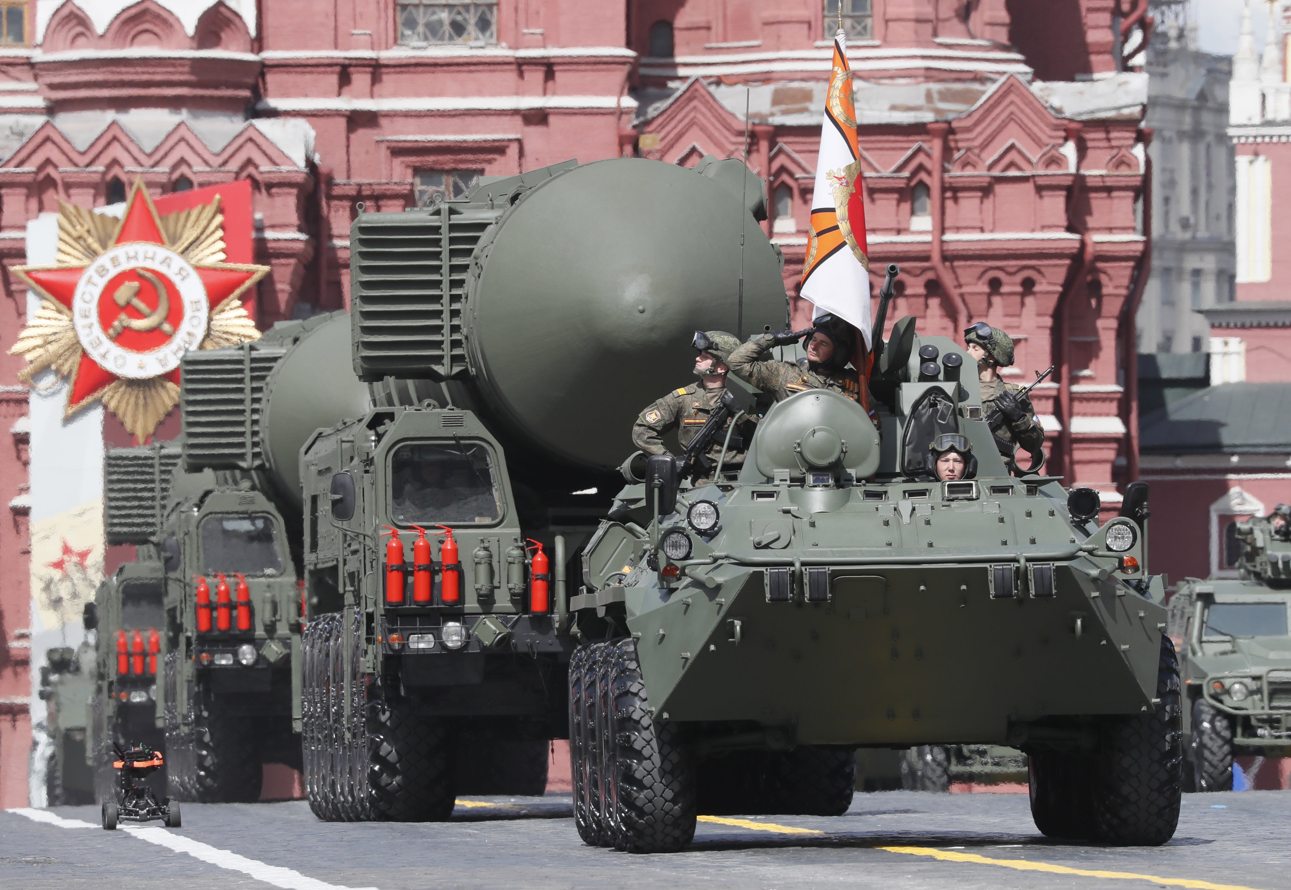 Russian Yars intercontinental ballistic missile launchers roll through Red Square on 9 May