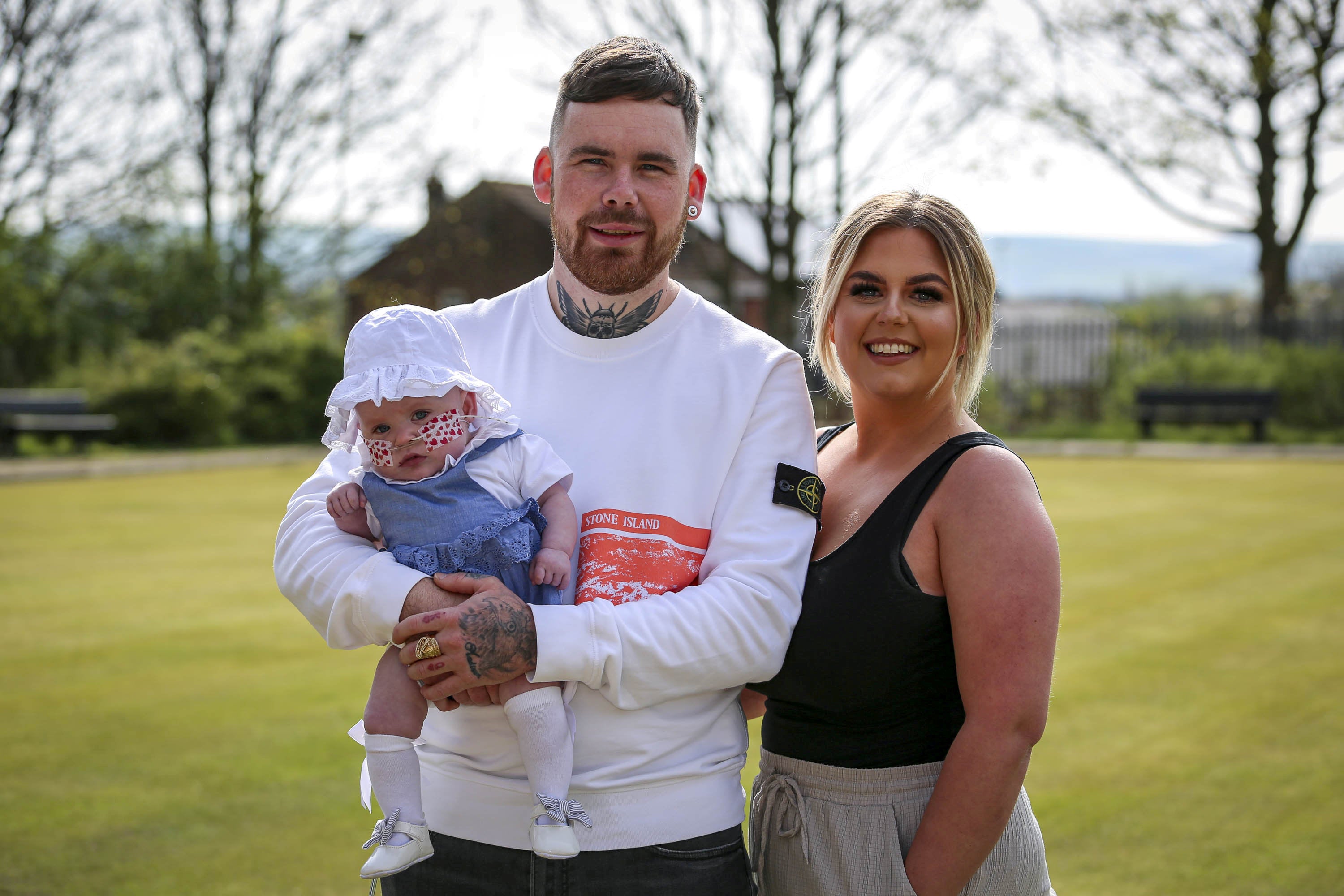 Little Elsie, now eight months, was born at just 23 weeks and is now thriving after 70 days on life-support. Here she is pictured with her parents Katie and Rob Hampson at a fundraiser event in their hometown of Rochdale, Greater Manchester