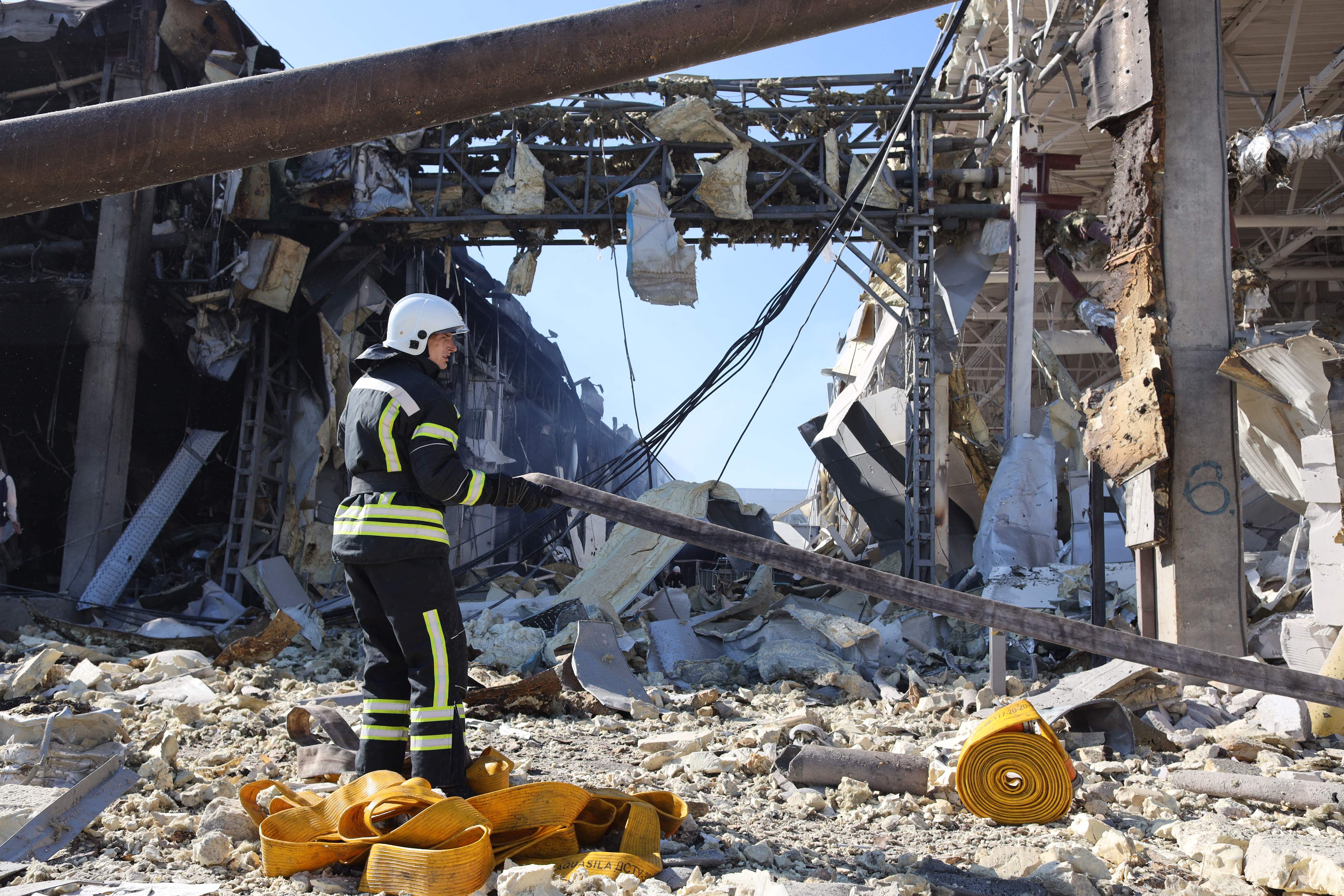 First responders try to clear rubble in the hard hit Odesa region