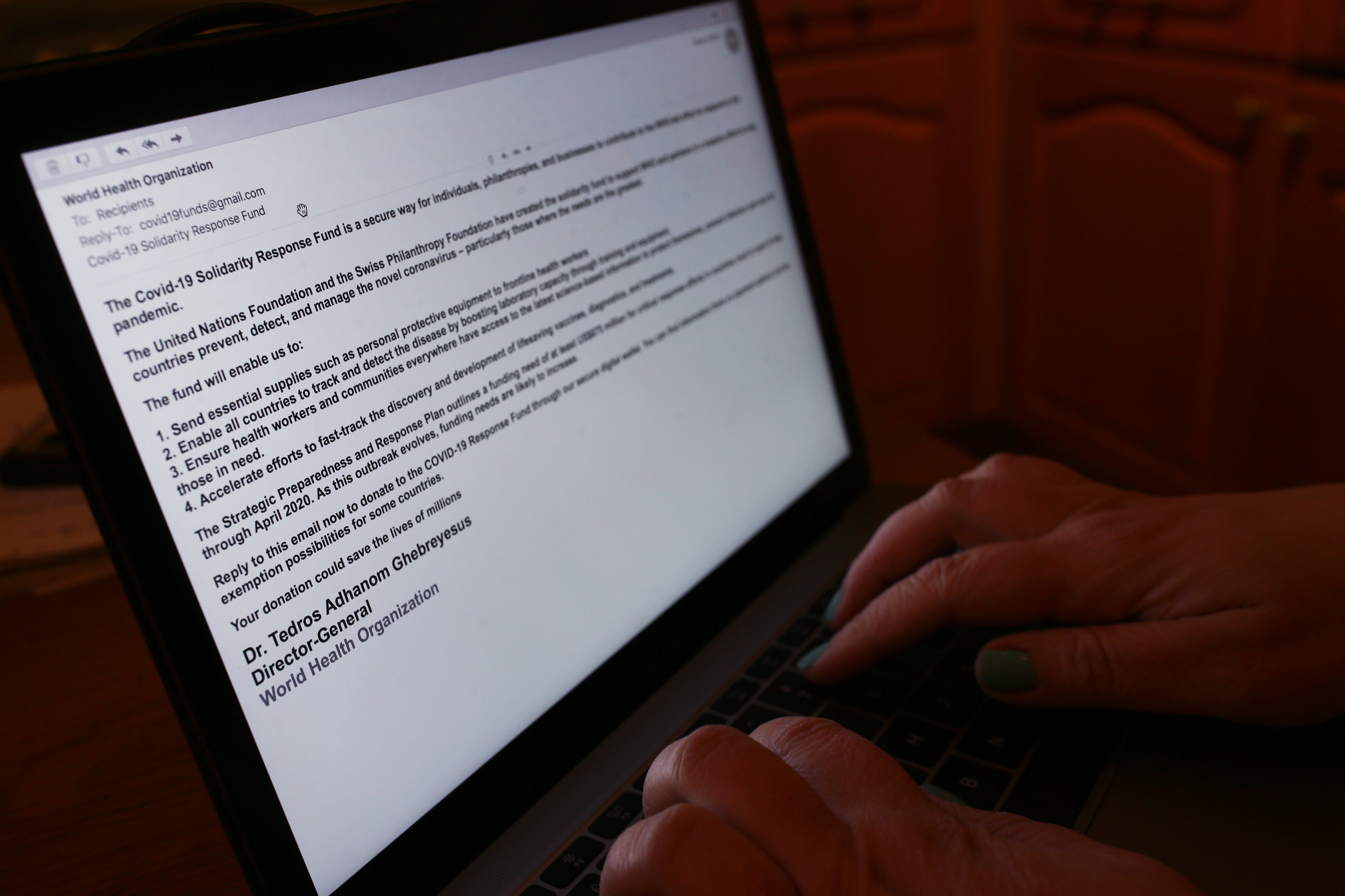A phishing email from someone posing as the head of the World Health Organization (WHO), and asking recipients to donate money to a coronavirus fund, received on a laptop in London (PA)