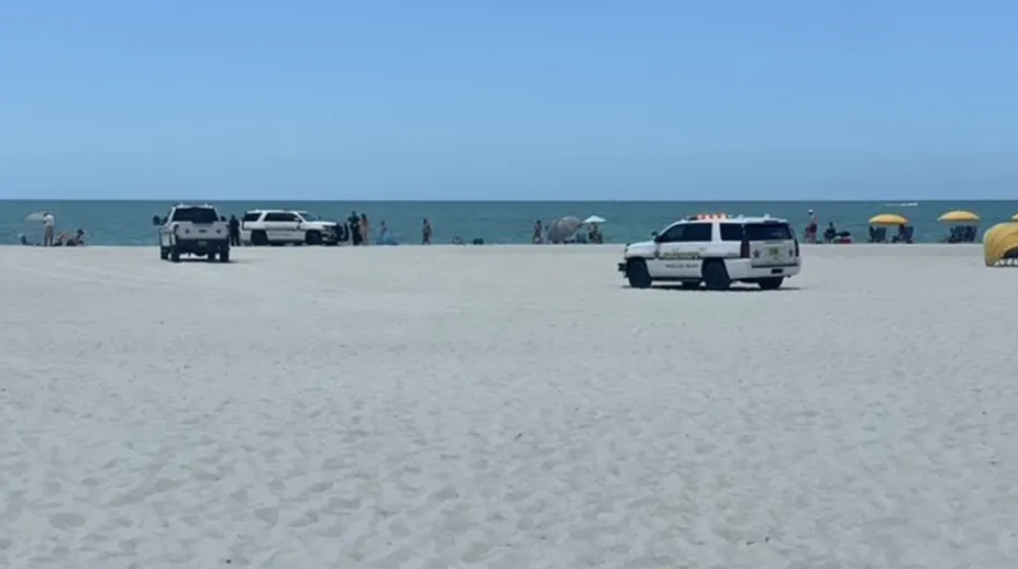 The scene at a Florida beach as deputies from the Pinellas County Sheriff’s Office tend to a 23-year-old sunbather who was struck by a deputy’s SUV in May.