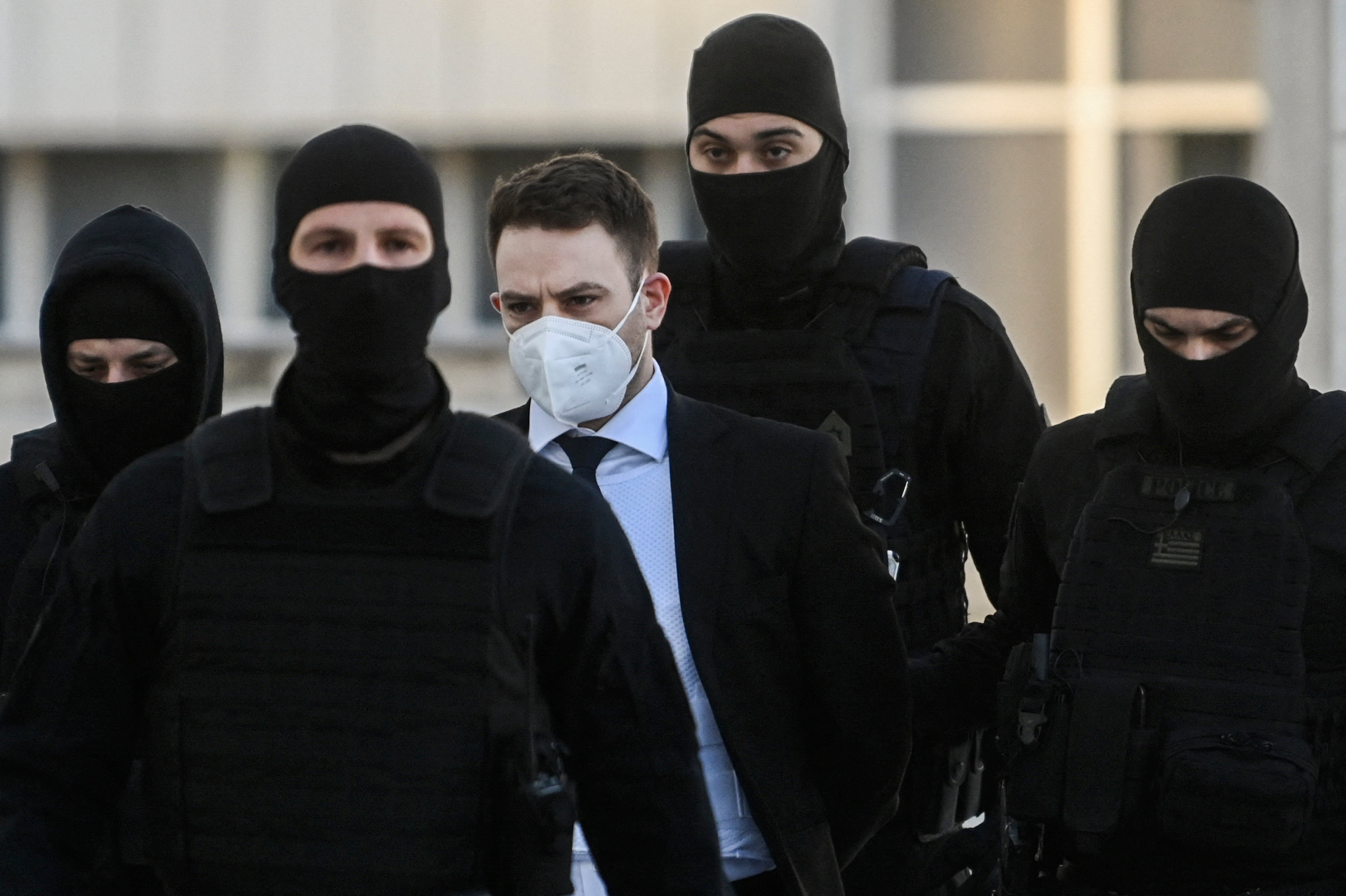 Babis Anagnostopoulos (C) arrives at the court escorted by police in April