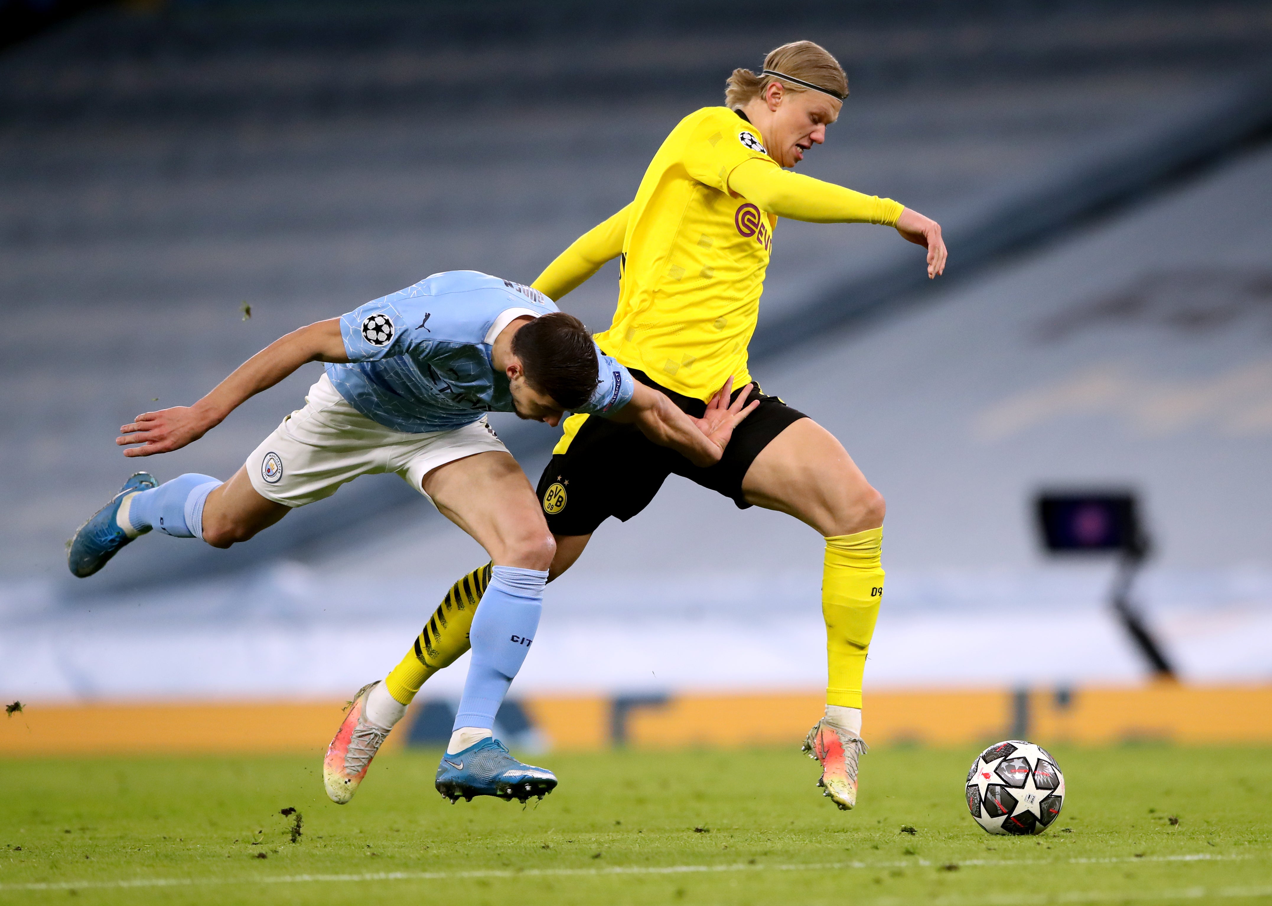 Erling Haaland, right, takes on Manchester City’s Ruben Dias in the Champions League (Nick Potts/PA)