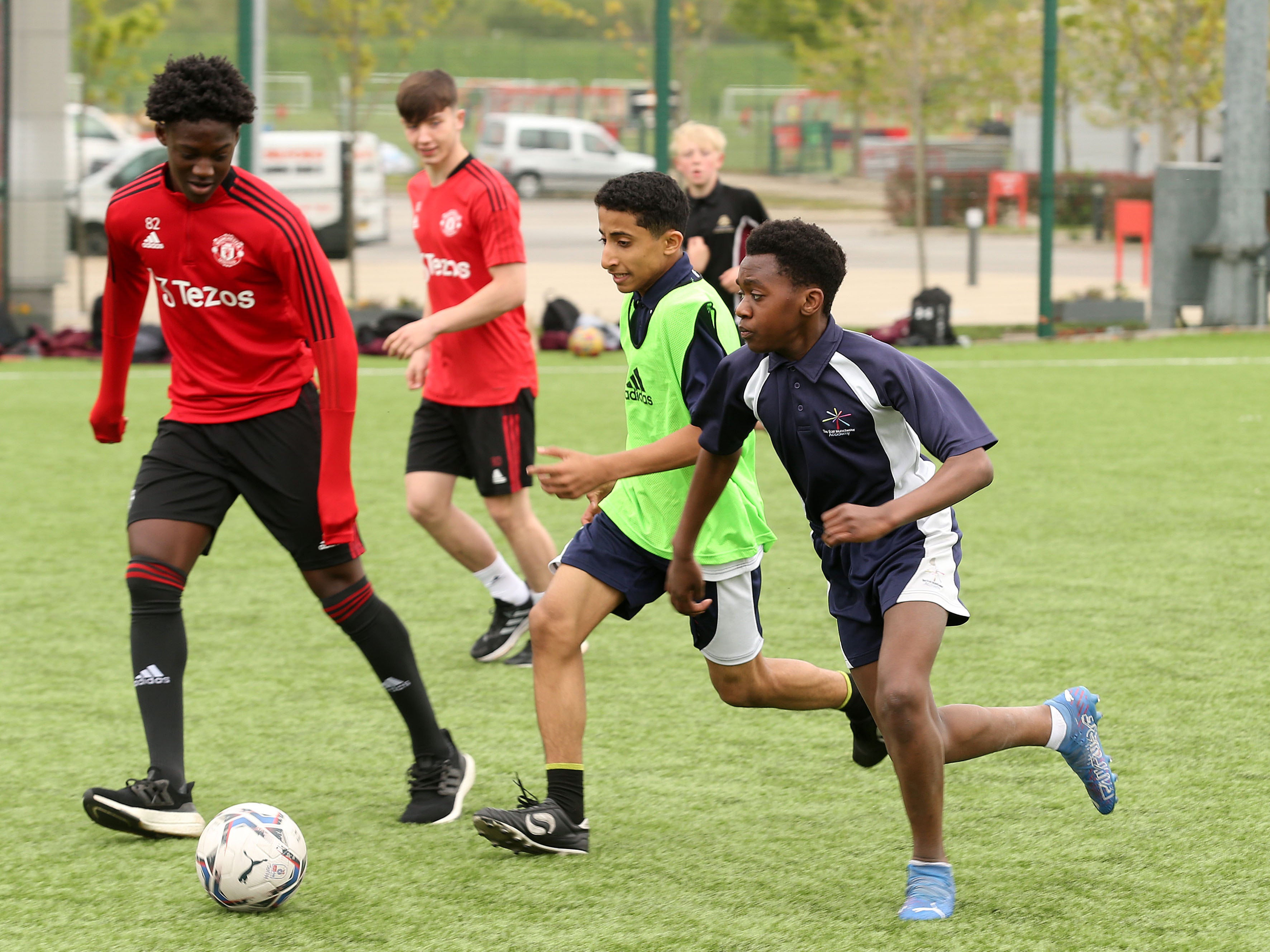 United’s academy players take on local schoolchildren at Carrington