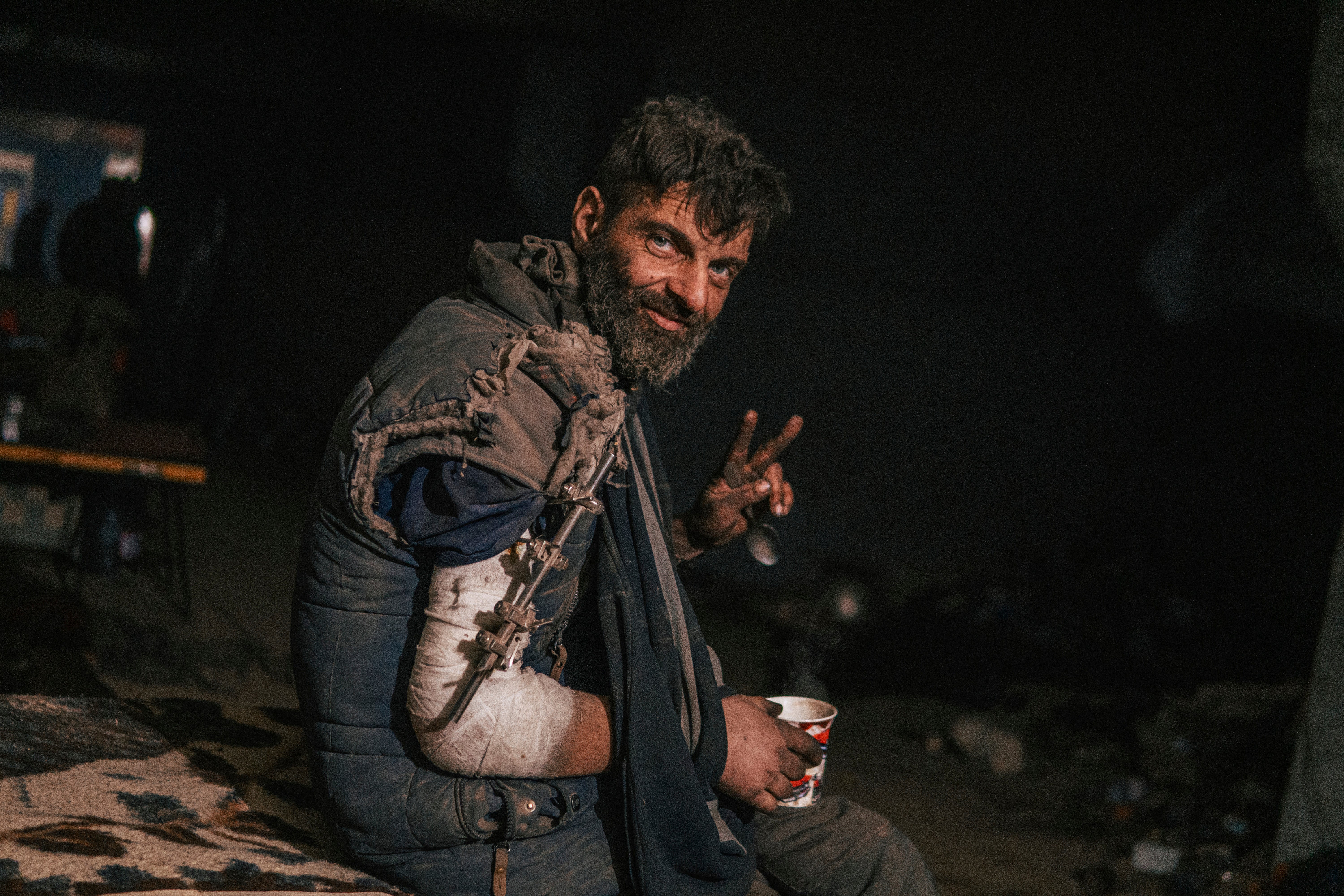 An Azov Special Forces Regiment’s serviceman, injured during fighting against Russian forces, poses for a photographer inside the Azovstal steel plant in Mariupol on 10 May