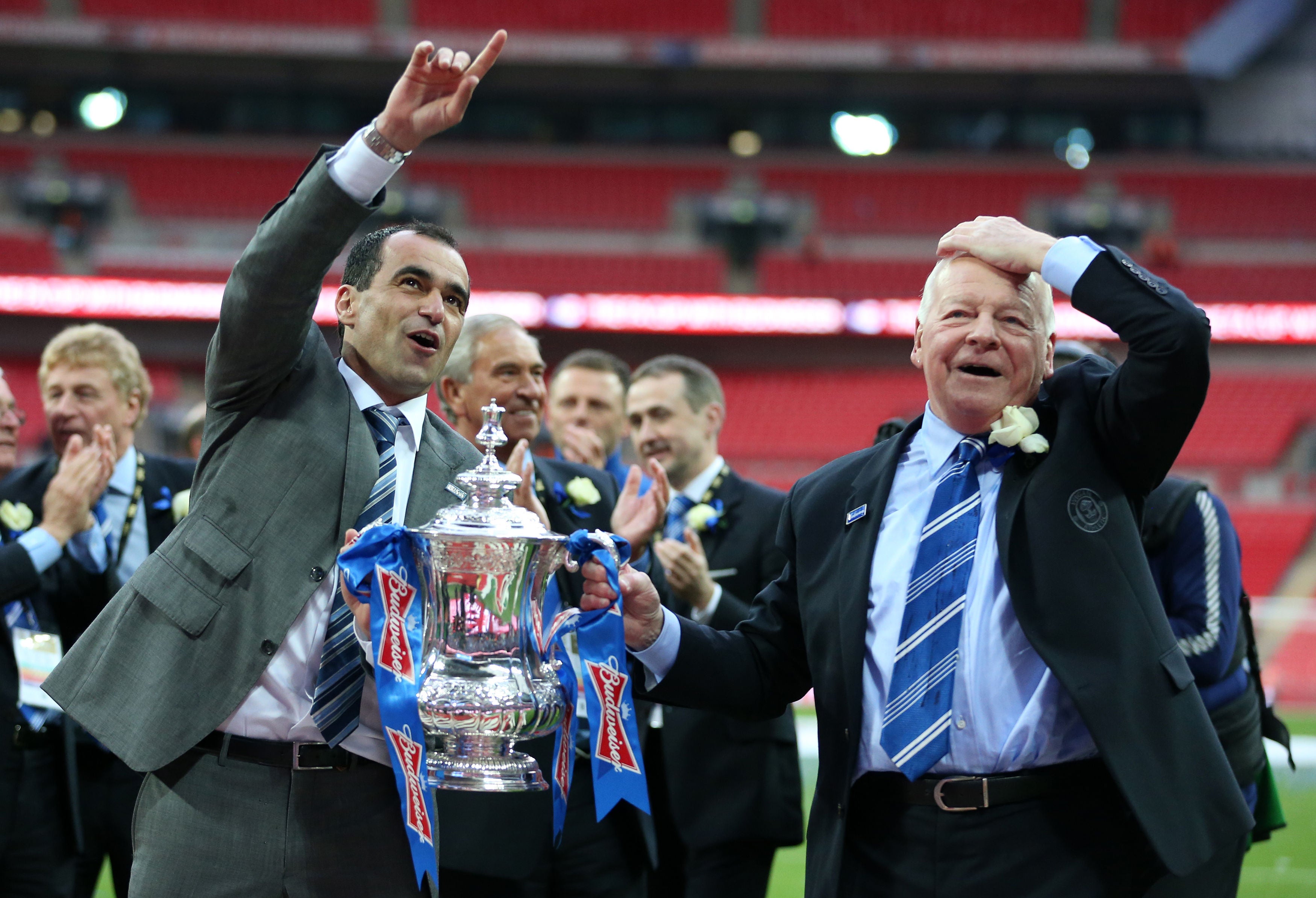 Wigan manager Roberto Martinez (left) and chairman Dave Whelan celebrate an unlikely FA Cup final victory over Manchester City (Anthony Devlin/PA)