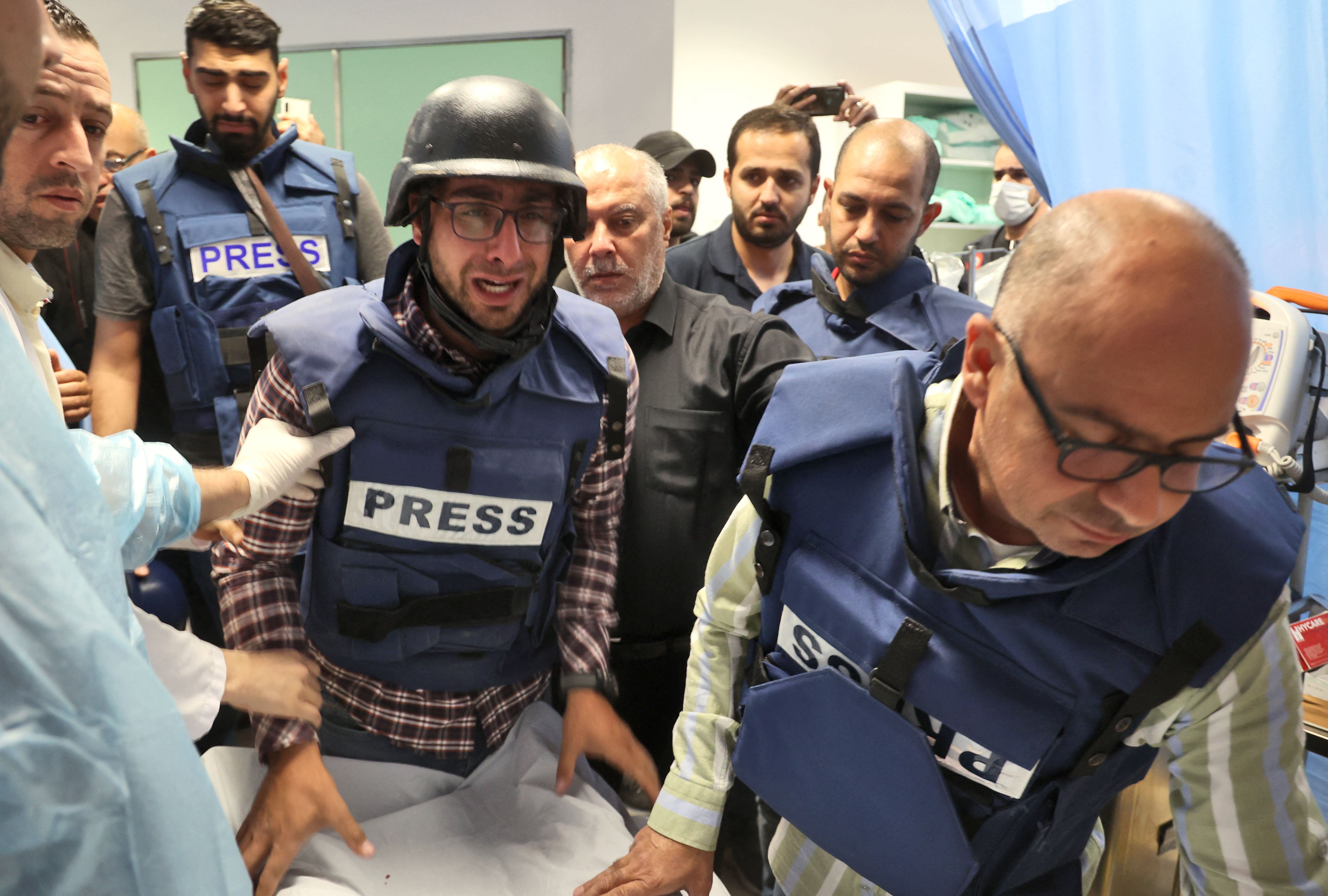 Journalists escorting veteran Al Jazeera journalist Shireen Abu Akleh, who was shot in the West Bank, to the hospital in Jenin