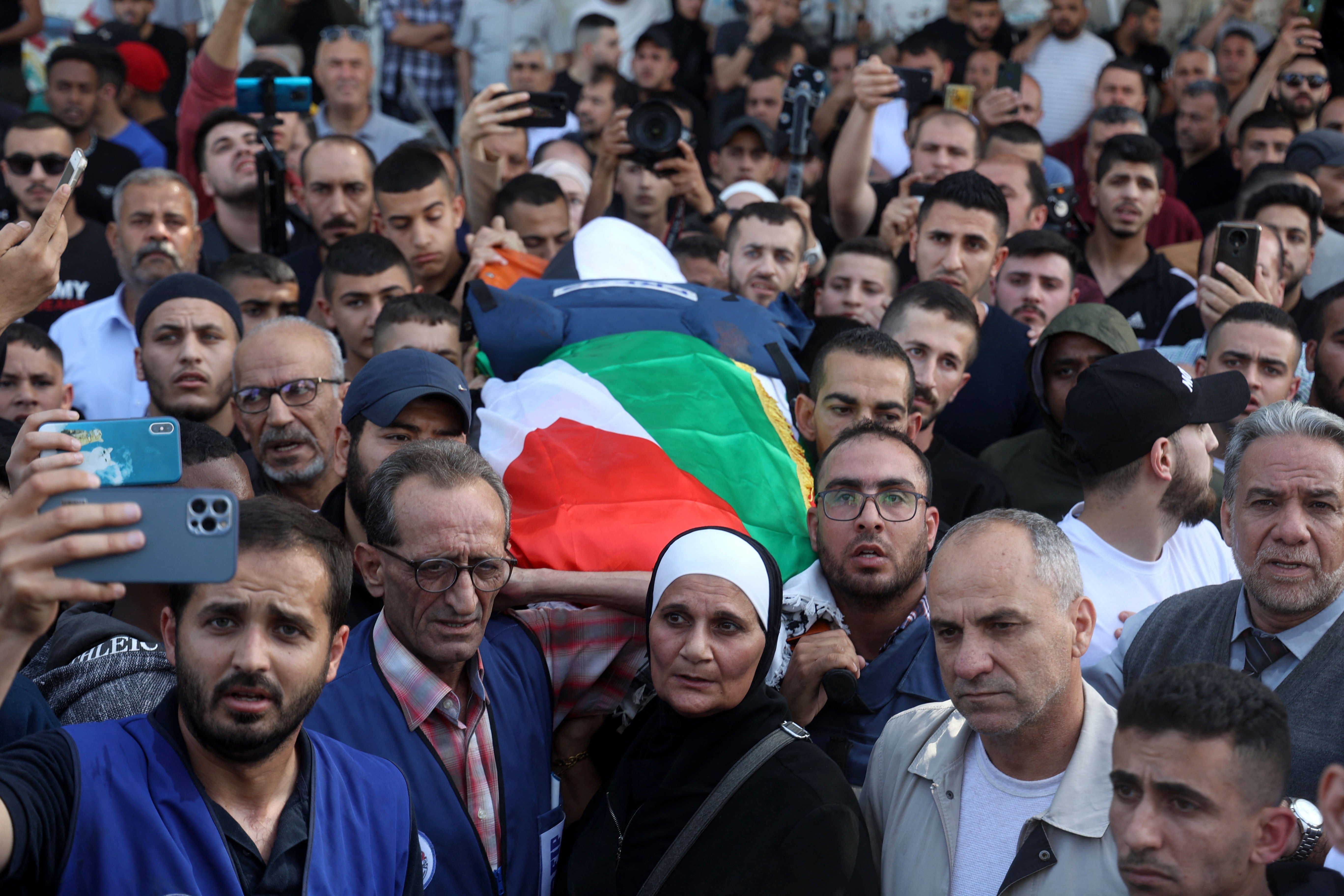 Mourners carry the body of veteran Al Jazeera journalist Shireen Abu Akleh during her funeral