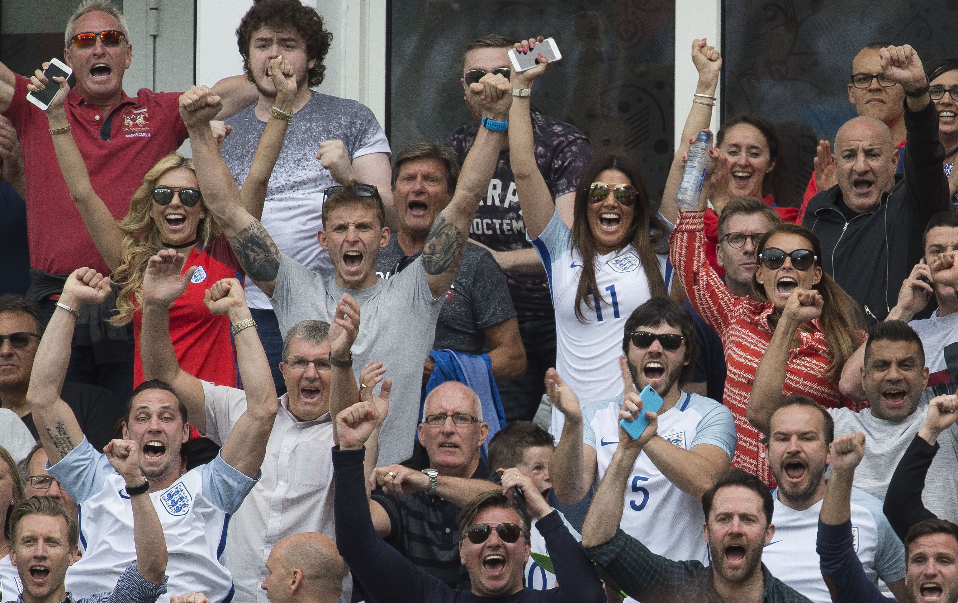 The friends were seen cheering on their partners from the stands