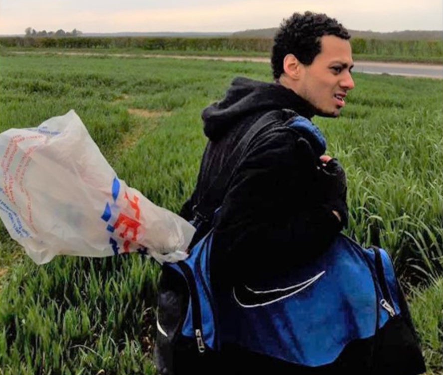 Gamekeeper Gavin Tucker captured this image of Callum Wheeler walking through fields near Aylesham, Kent, carrying a blue holdall with what prosecutors claim is the murder weapon poking out