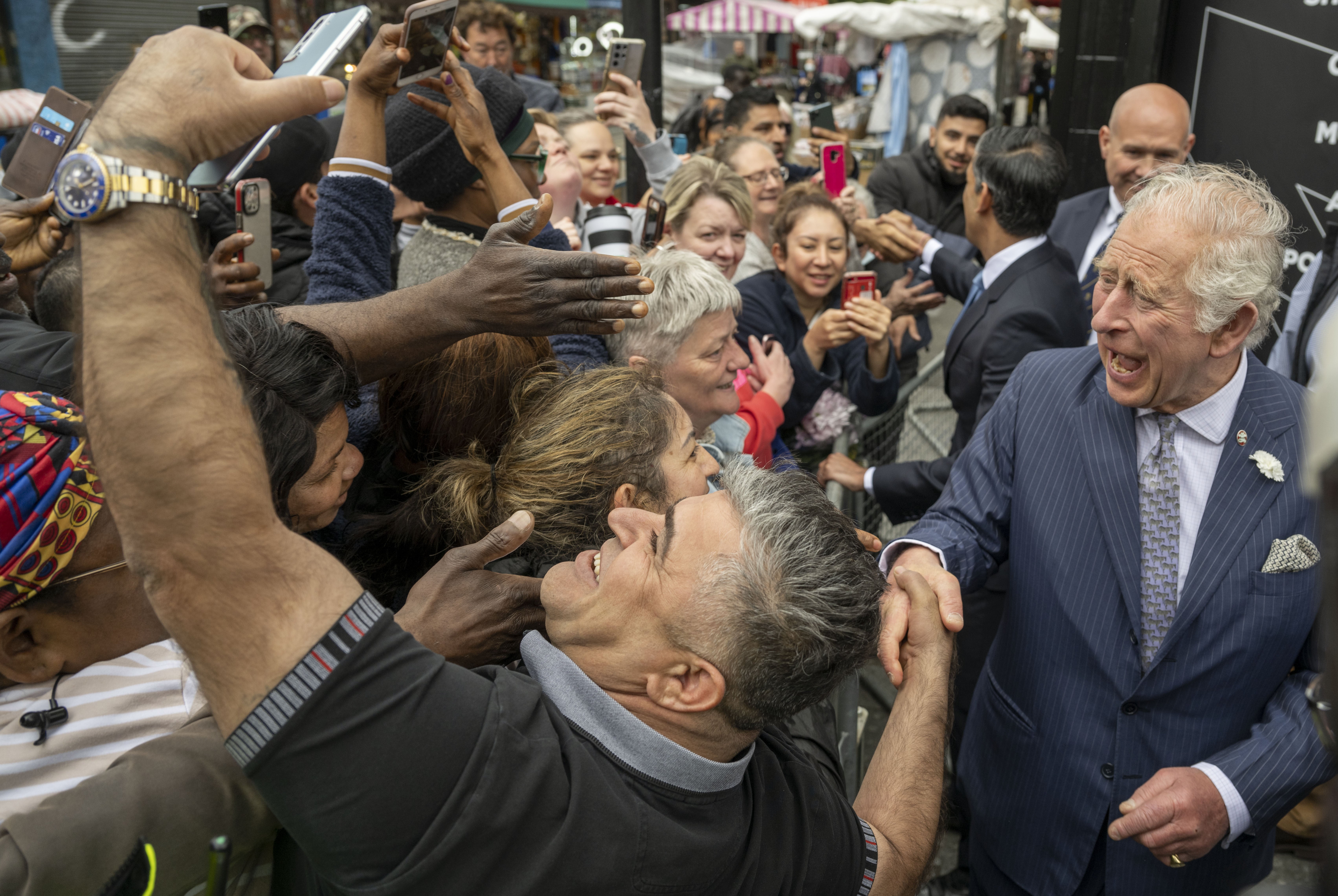 The Prince of Wales, accompanied by Chancellor Rishi Sunak meeting the public in Walworth, London (Paul Grover/Daily Telegraph/PA)