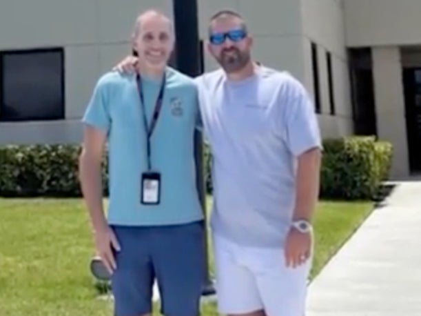 Air traffic controller Robert Morgan poses for a picture with the passenger that he helped land a Cessna Caravan