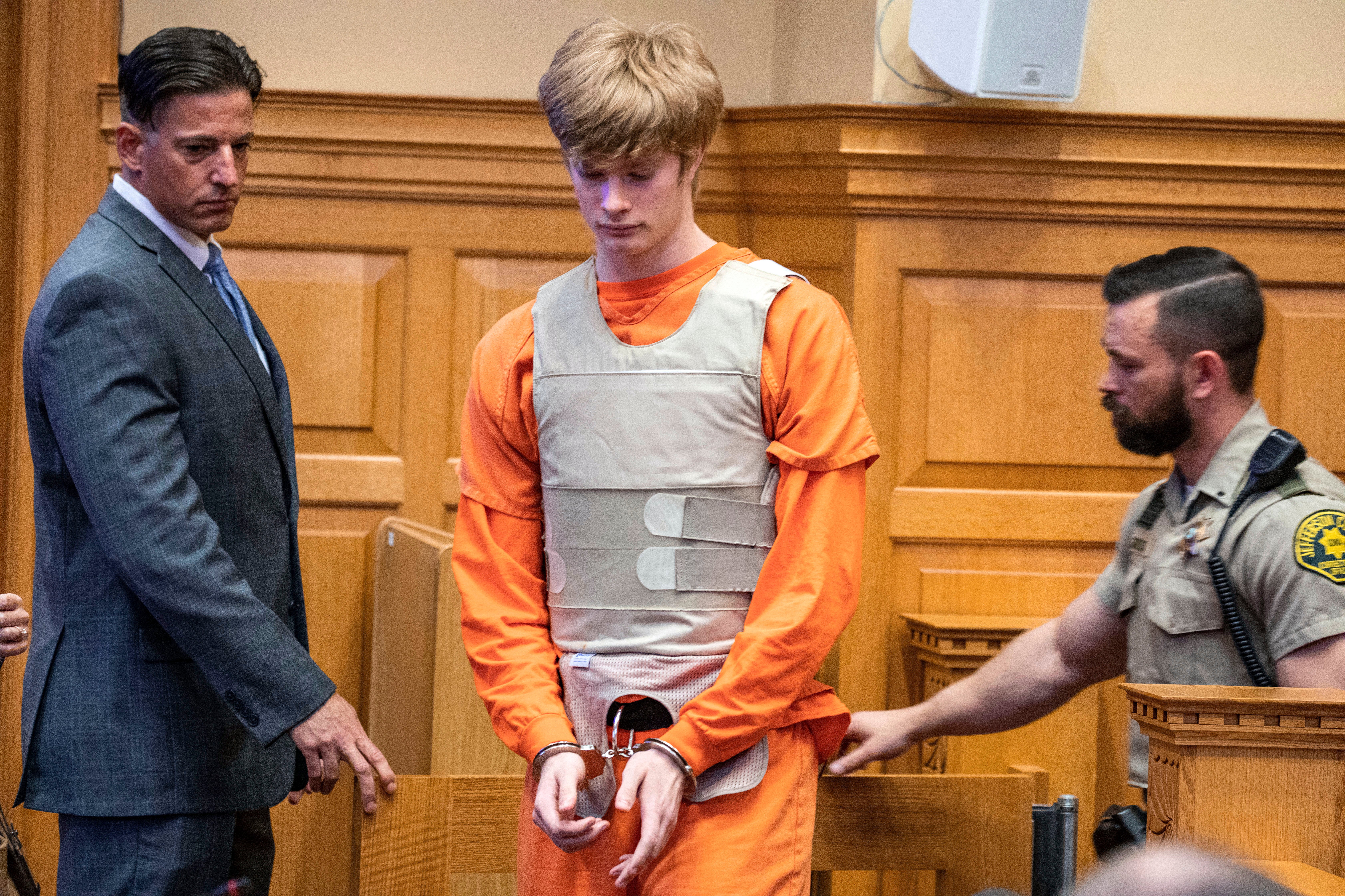 Jeremy Everett Goodale, center, enters the courtroom