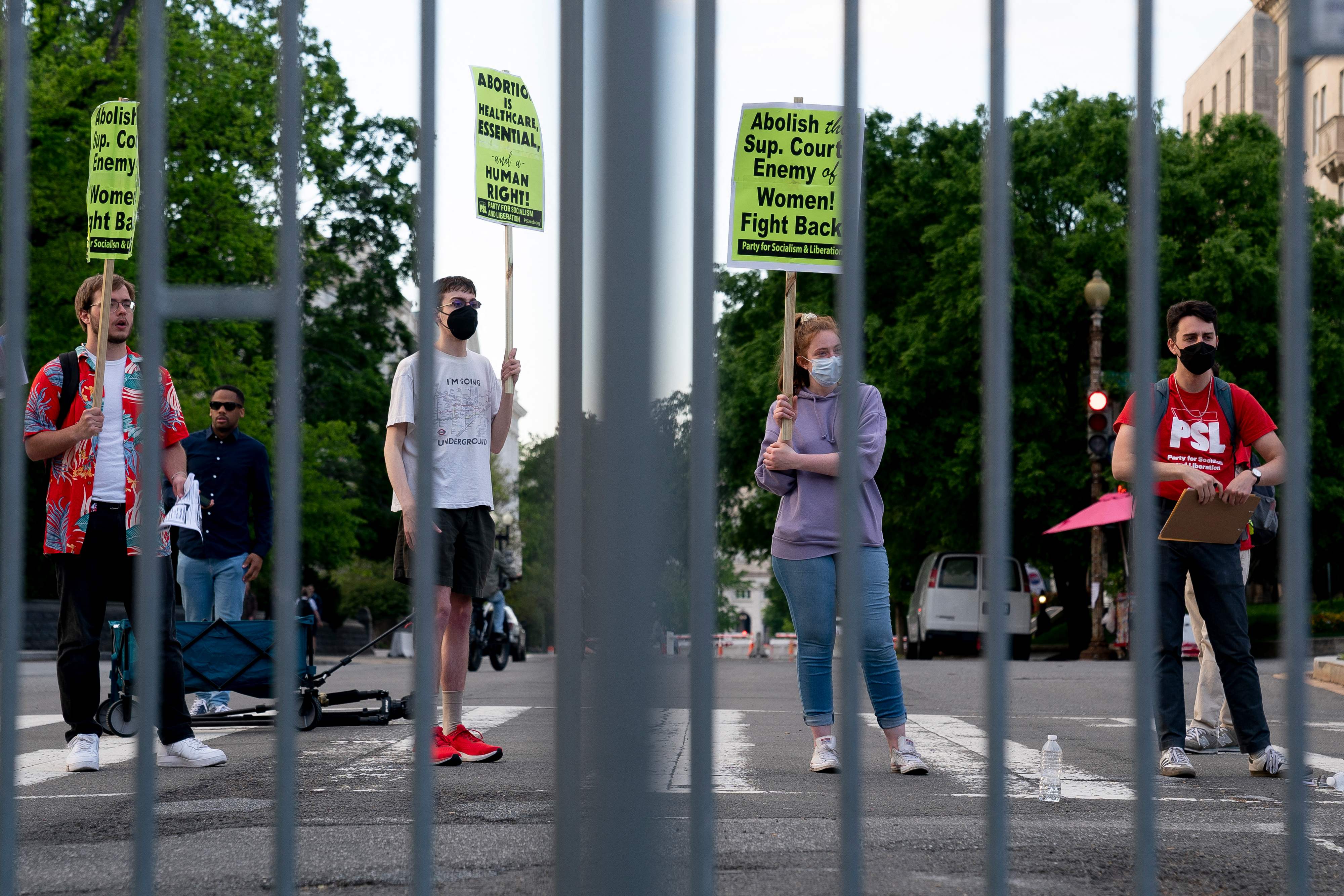 Pro-choice demonstrators are seen through police barricades in front of the US Supreme Court in Washington, DC, on May 11, 2022