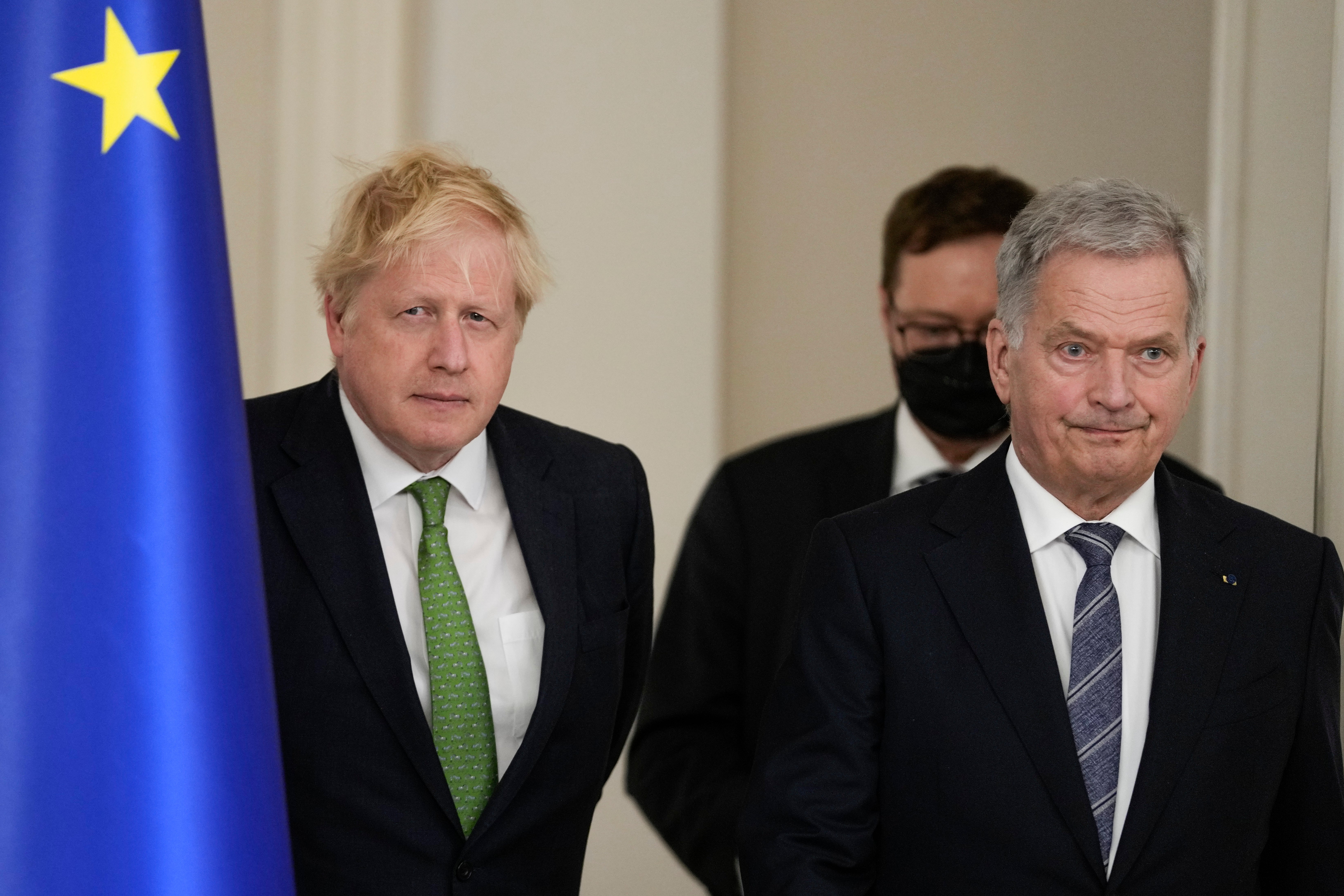 British Prime Minister Boris Johnson, left, and Finland's President Sauli Niinisto arrive to meet the media