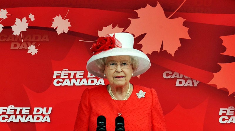 The Queen wearing the Maple Leaf Brooch and the colours of the Canadian Flag during a tour to Canada (John Stillwell/PA)