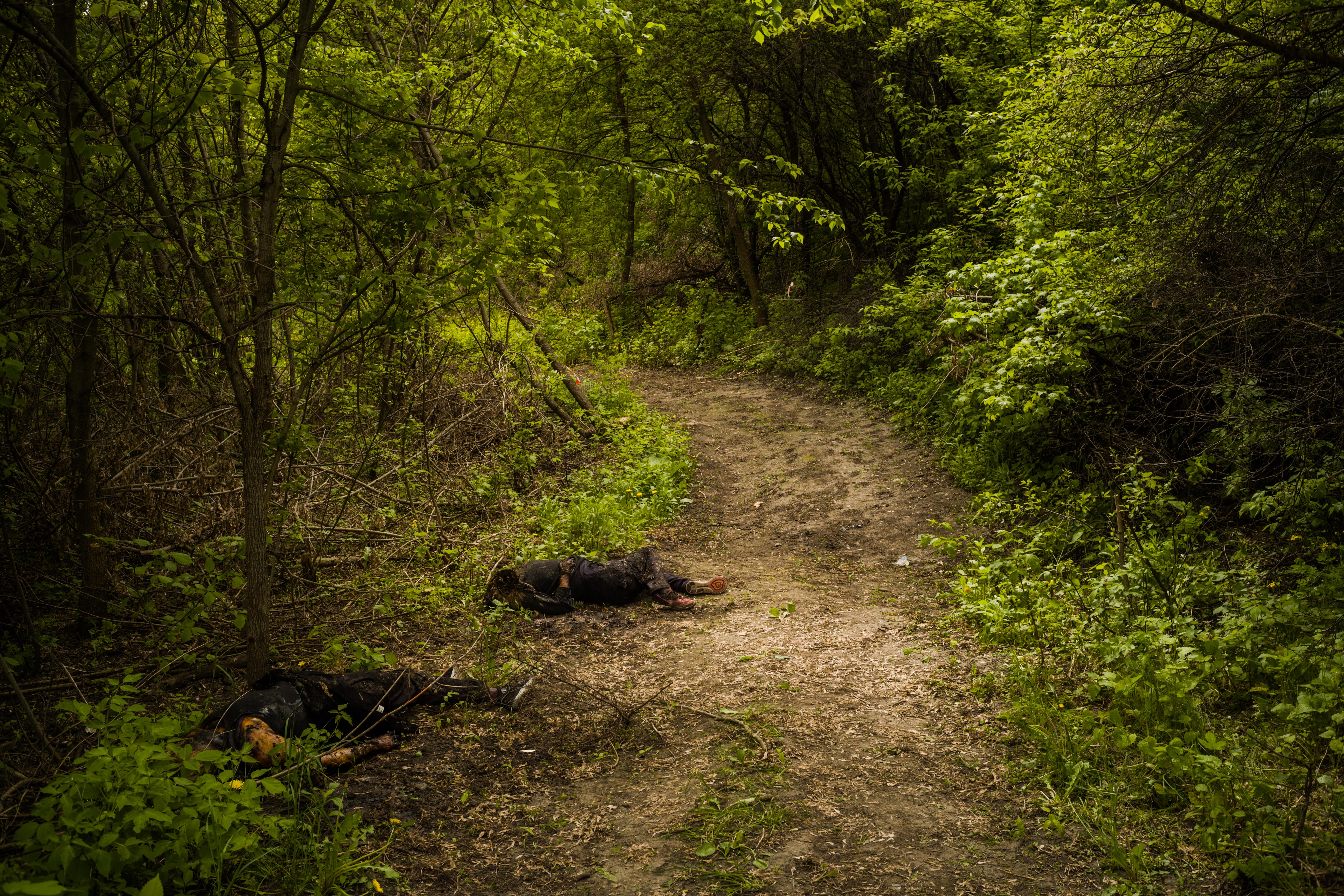 The bodies of the two women, who police said had been killed by a Russian land mine weeks earlier