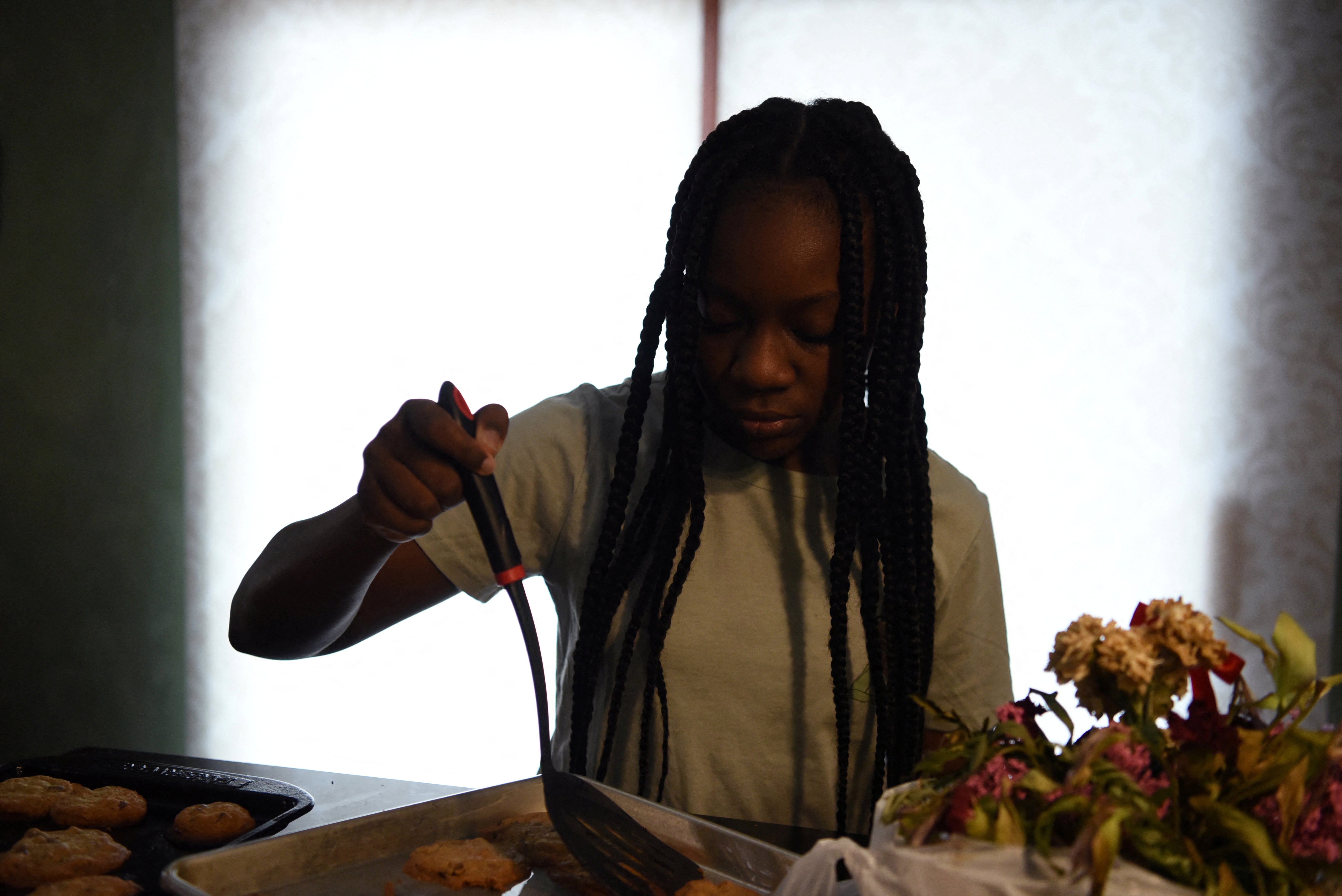 Justise McGowan bakes cookies, a tradition she shared with her father